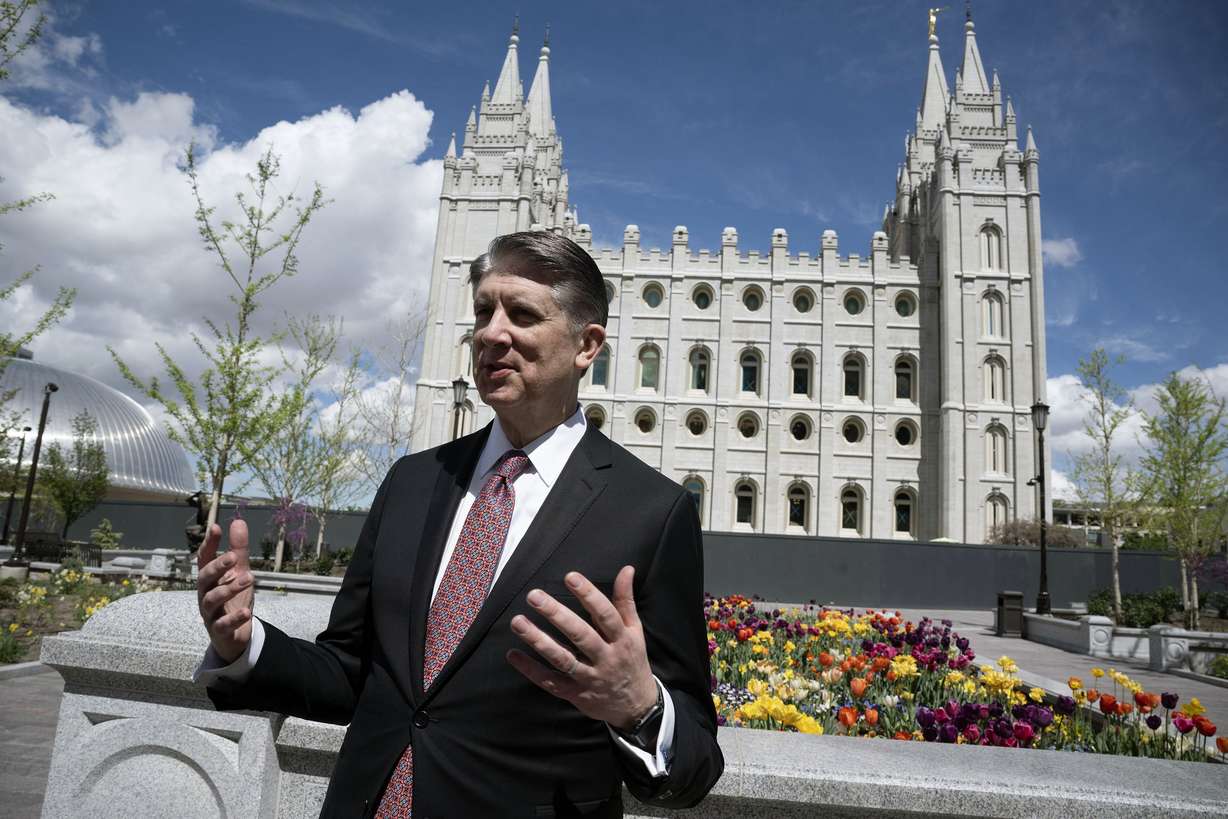 Elder Matthew S. Holland, general authority seventy of The Church of Jesus Christ of Latter-day Saints, talks with members of the media as they tour the new visitors' center on Temple Square in Salt Lake City on Monday.