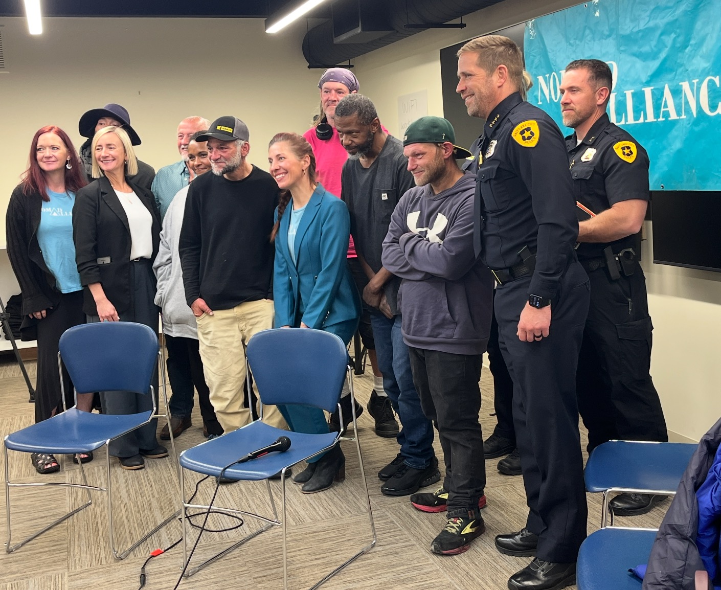 Participants of the Nomad Alliance's roundtable on homeless and addiction concerns pose for a photo after the meeting in Salt Lake City on Monday.