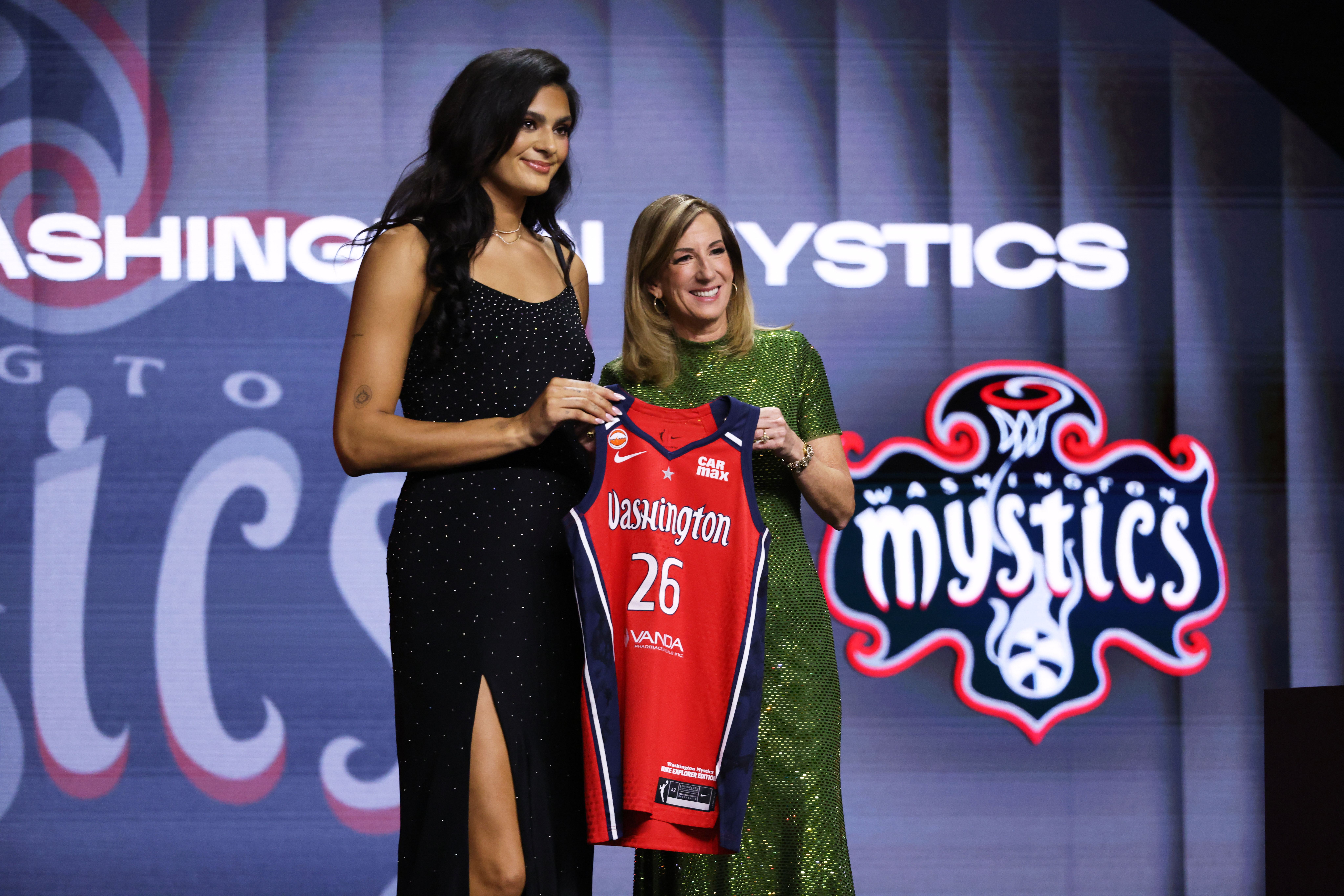UCLA center Lauren Betts poses with WNBA commissioner Cathy Engelbert after being selected fourth overall by the Washington Mystics in the first round of the WNBA basketball draft Monday, April 13, 2026, in New York. 