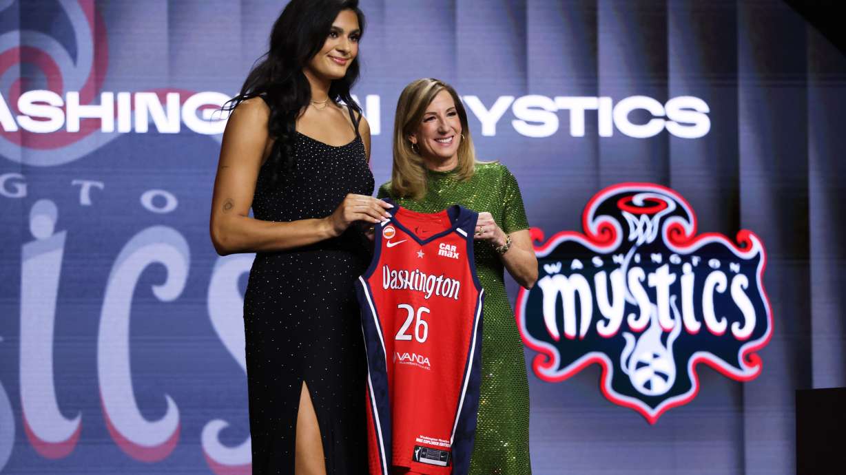 UCLA center Lauren Betts poses with WNBA commissioner Cathy Engelbert after being selected fourth overall by the Washington Mystics in the first round of the WNBA basketball draft Monday, April 13, 2026, in New York.