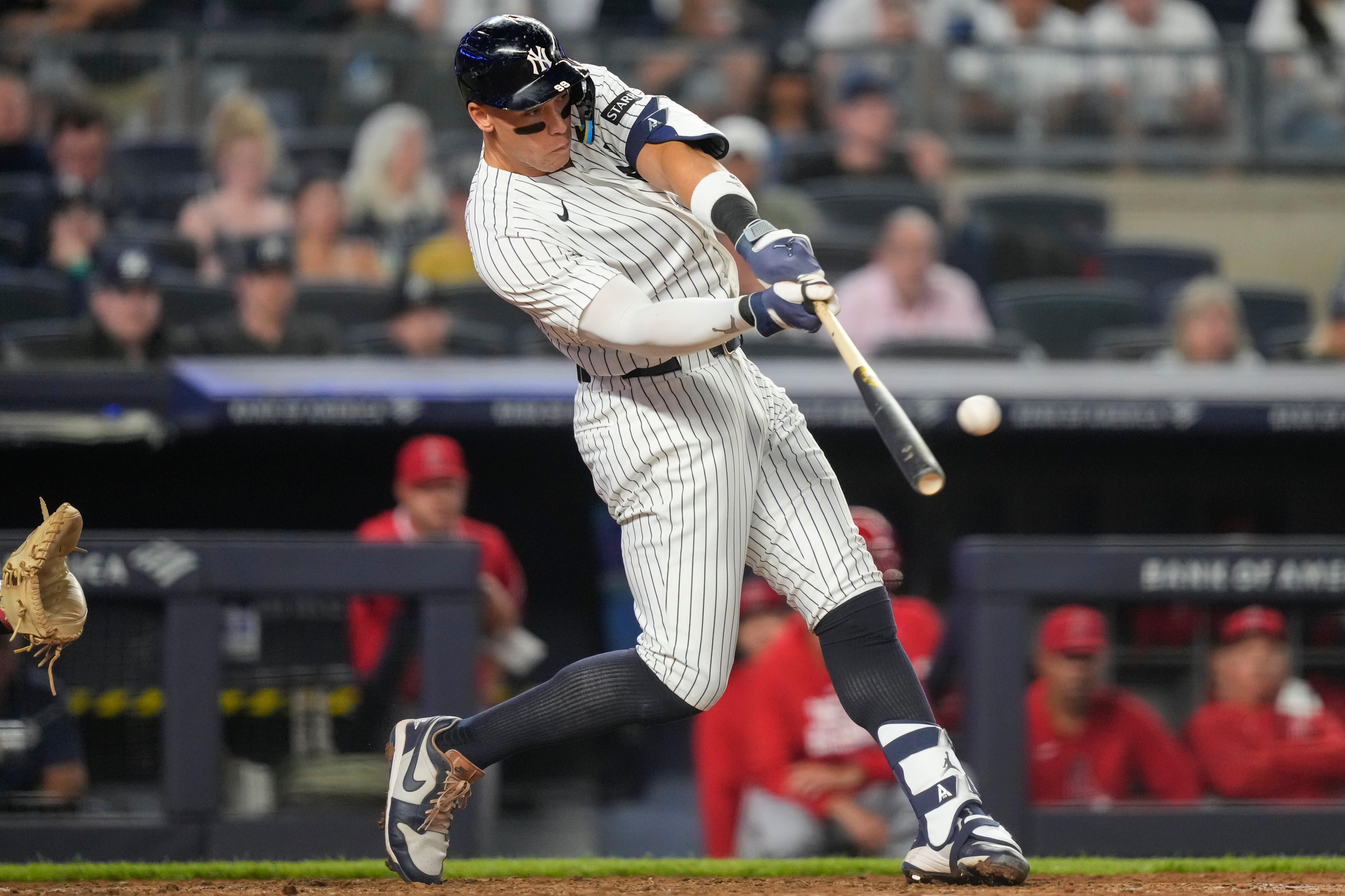 New York Yankees' Aaron Judge hits a home run during the sixth inning of a baseball game against the Los Angeles Angels, Monday, April 13, 2026, in New York. 