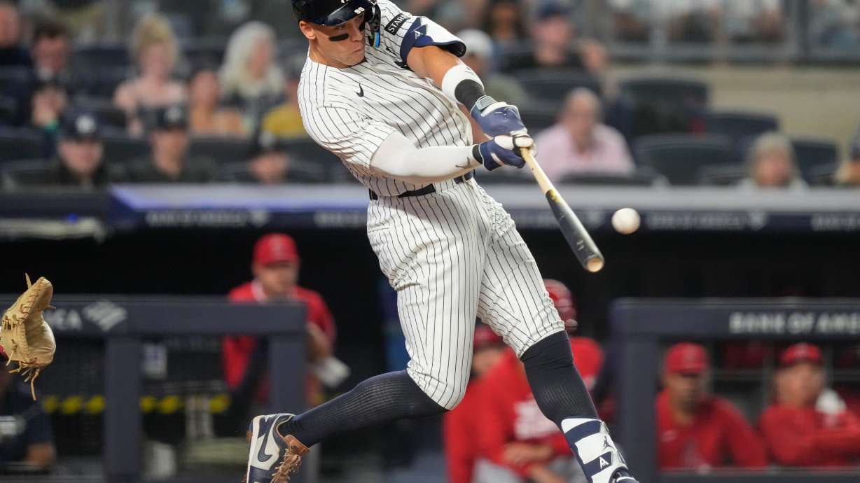 New York Yankees' Aaron Judge hits a home run during the sixth inning of a baseball game against the Los Angeles Angels, Monday, April 13, 2026, in New York.