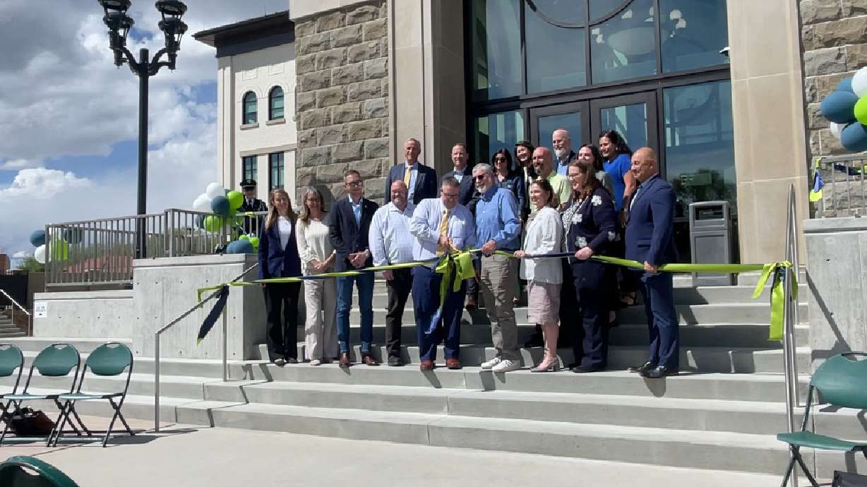 Lehi Mayor Paul Binns cuts the ribbon on the city's new civic center alongside current and former elected officials on Monday. The facility serves as an ode to the city's past while honoring its future.