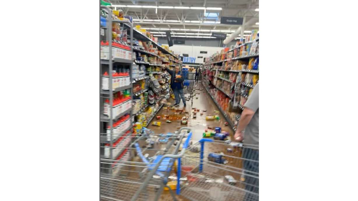Items are scattered across grocery store aisle floors in Fallon, Nev., on Monday after a magnitude 5.7 earthquake.