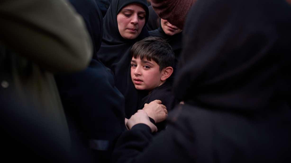 Mohammed, 8, cries next to the coffin of his father, Hussein Makkah, during the funeral of 13 state security officers killed the previous day in an Israeli strike in Lebanon’s coastal city of Sidon, Lebanon, Saturday.