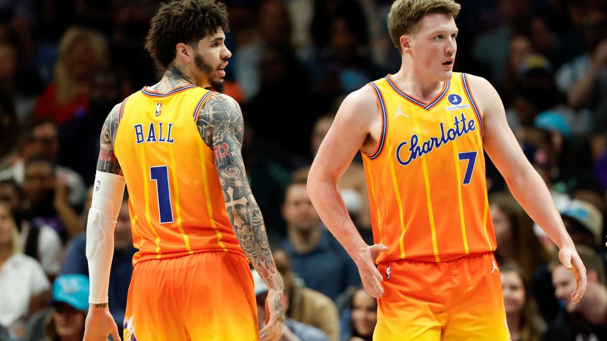 Charlotte Hornets guard LaMelo Ball (1) and guard Kon Knueppel (7) stand on the court during the first half of an NBA basketball game against the Detroit Pistons in Charlotte, N.C., Friday, April 10, 2026.