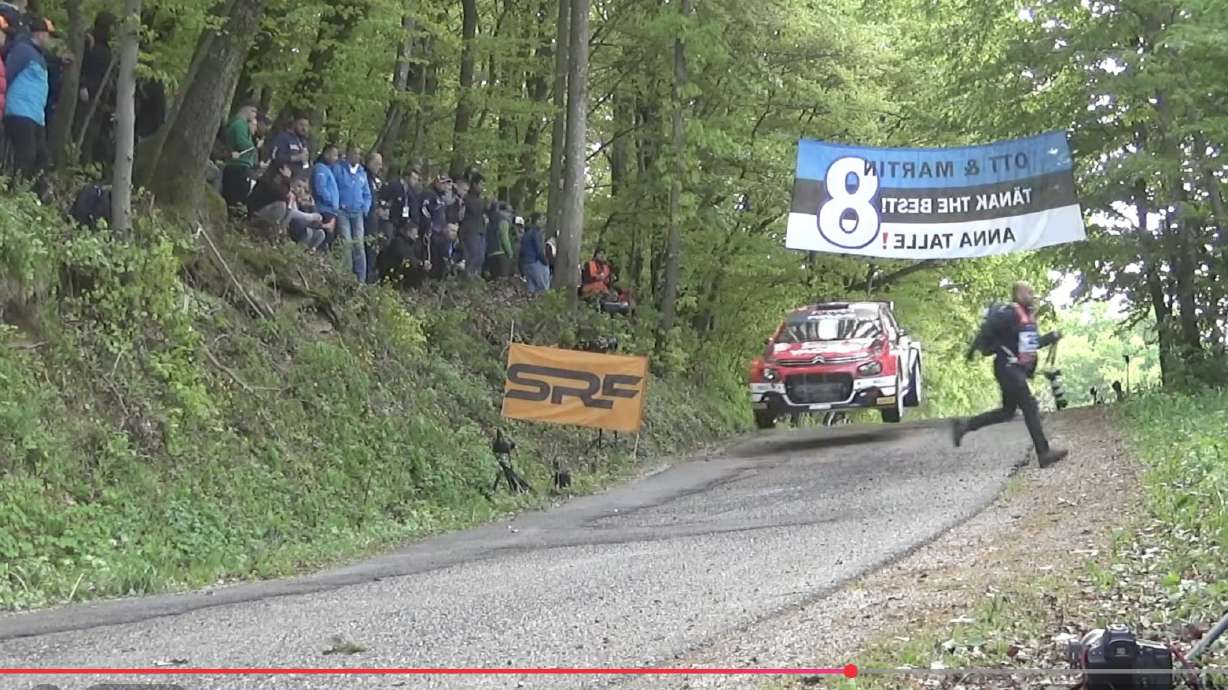 A photographer narrowly escapes a rally car at a Croatia event.