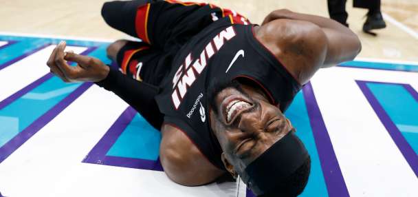 Heat's Bam Adebayo taken to locker room after Hornets' LaMelo Ball trips him, leading to hard fall