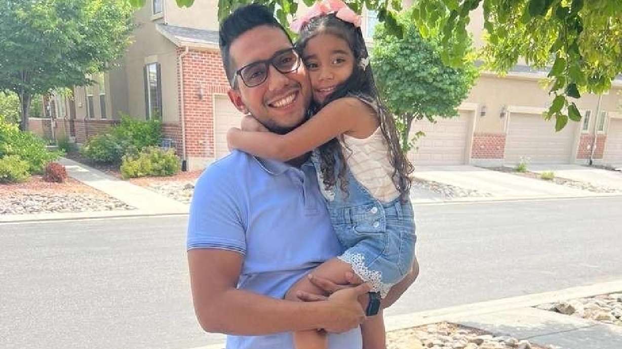Leandro Bermudez and his daughter Lucia, 7, in Murray in January. The father and daughter are stuck in Colombia, where they traveled to fix the girl's migratory status, after U.S. officials denied her visa request.