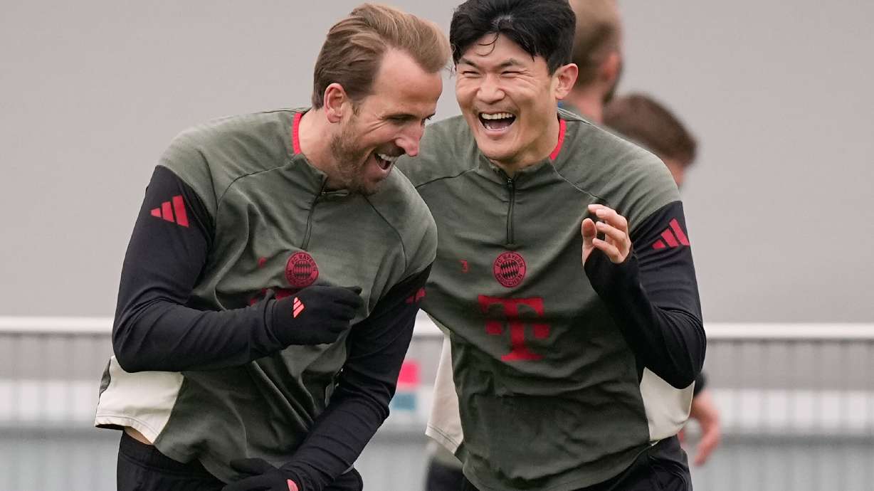 Bayern's Kim Min-jae and Bayern's Harry Kane having fun during a training session ahead of the Champions League quarterfinal second leg soccer match between Bayern Munich and Real Madrid in Munich, Germany, Tuesday, April 14, 2026.