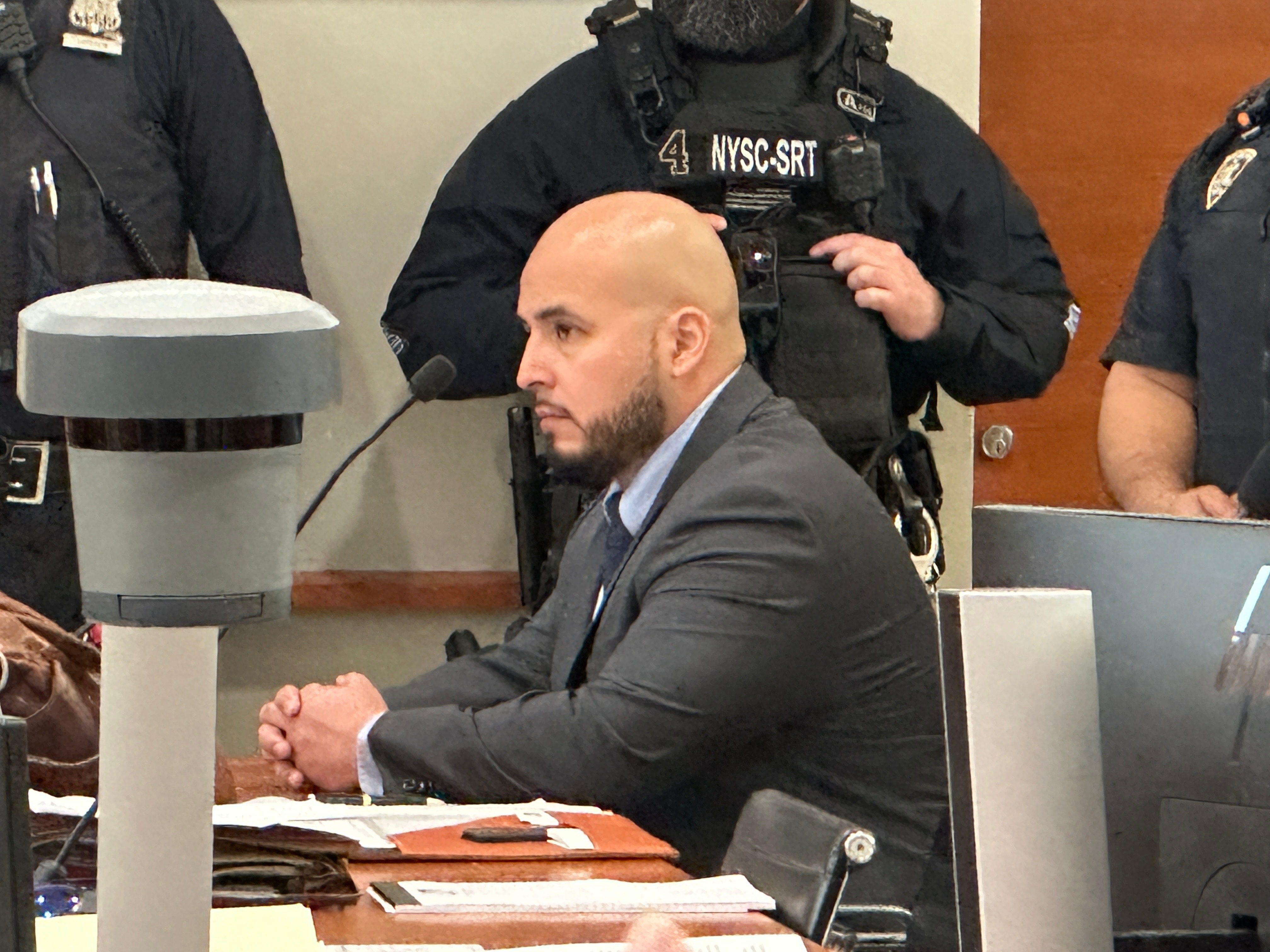 Former New York City police sergeant Erik Duran is seated during his sentencing hearing at the Bronx County Hall of Justice Thursday, April 9, 2026, New York, for tossing a picnic cooler full of drinks at a fleeing suspect, Eric Duprey, who then crashed his motorized scooter and died.