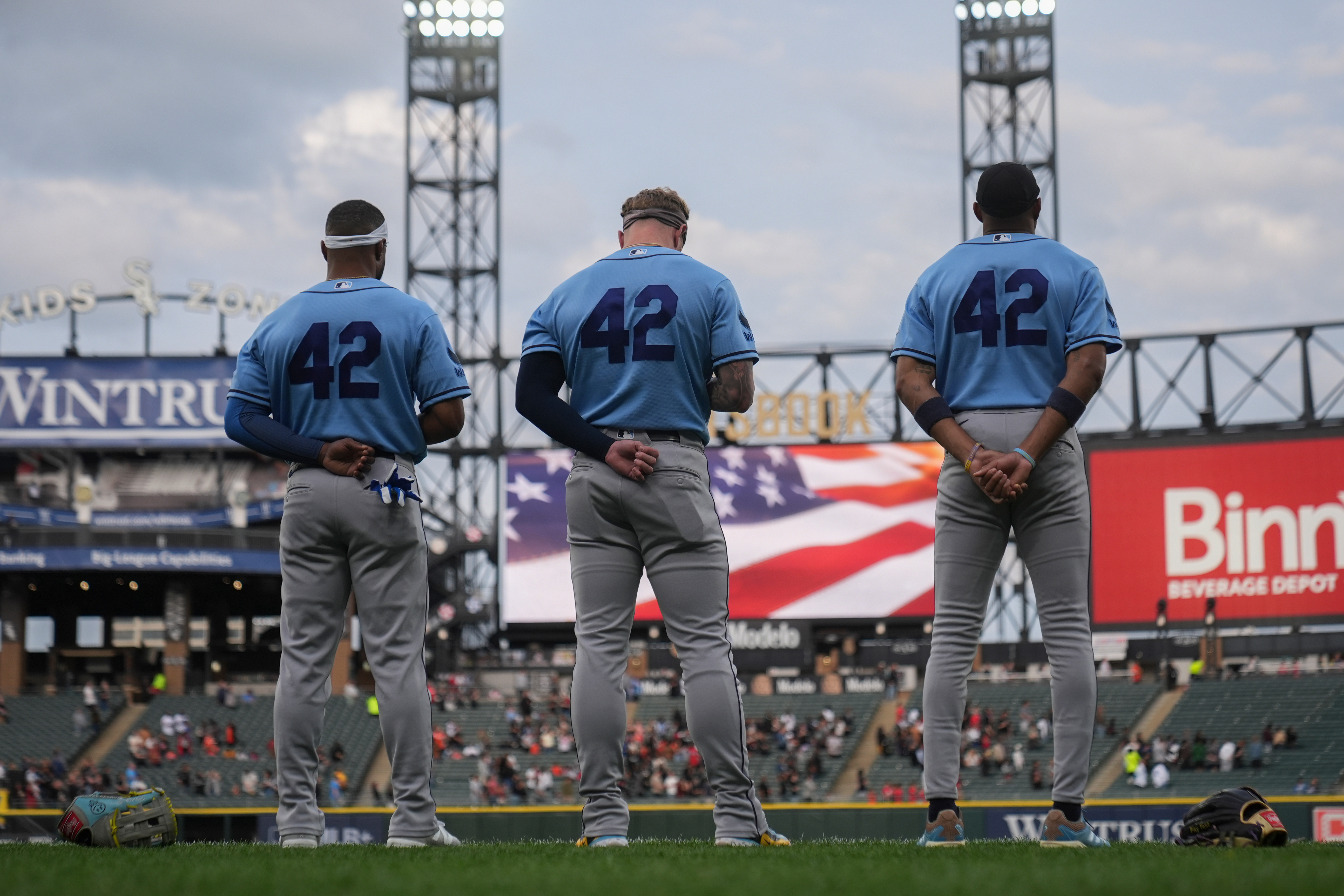 The Tampa Bay Rays stands for the Star-Spangled Banner on Jackie Robinson Day before a baseball game against the Tampa Bay Rays, Wednesday, April 15, 2026, in Chicago.