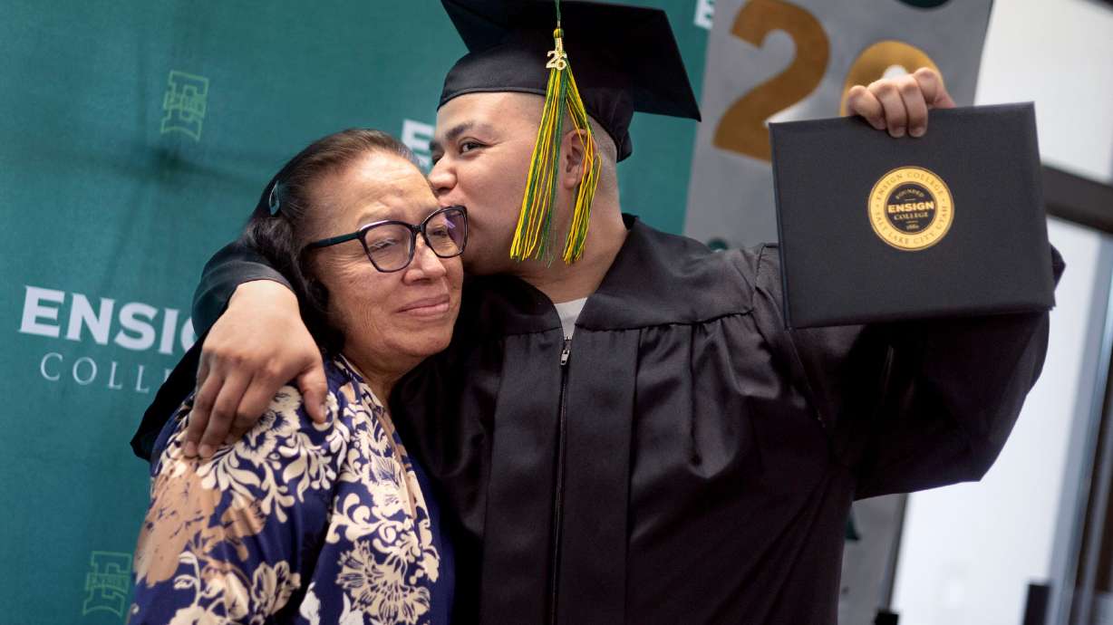 Maria and her son, Ivan, hug at the Ensign College Prison Education Program graduation at the Utah State Correctional Facility in Salt Lake City on Wednesday, the first commencement held off-campus in the school's history.