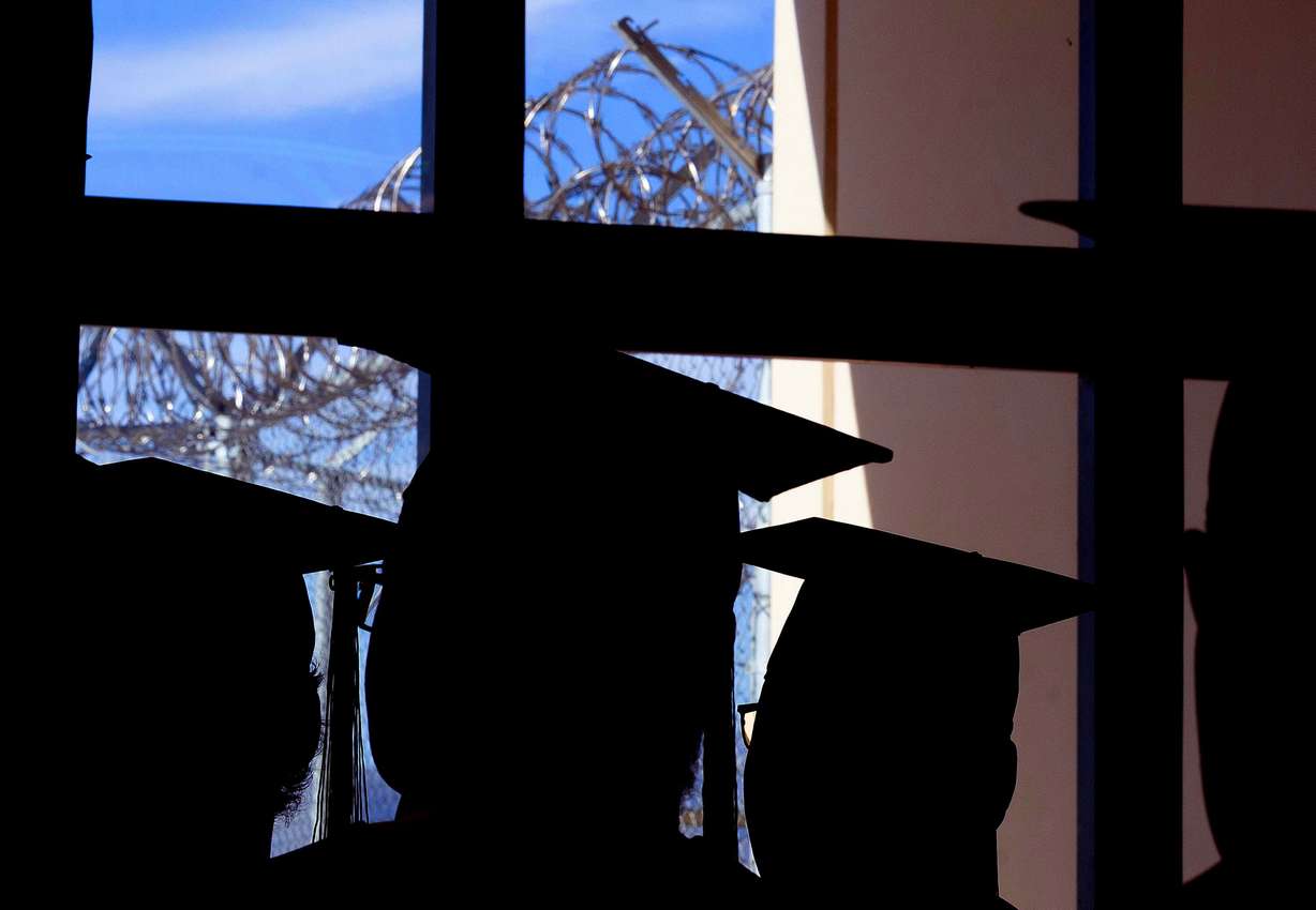 Graduates of the Ensign College Prison Education Program attend their graduation ceremony at the Utah State Correctional Facility in Salt Lake City on Wednesday. The ceremony was the first commencement held off-campus in the school's history.