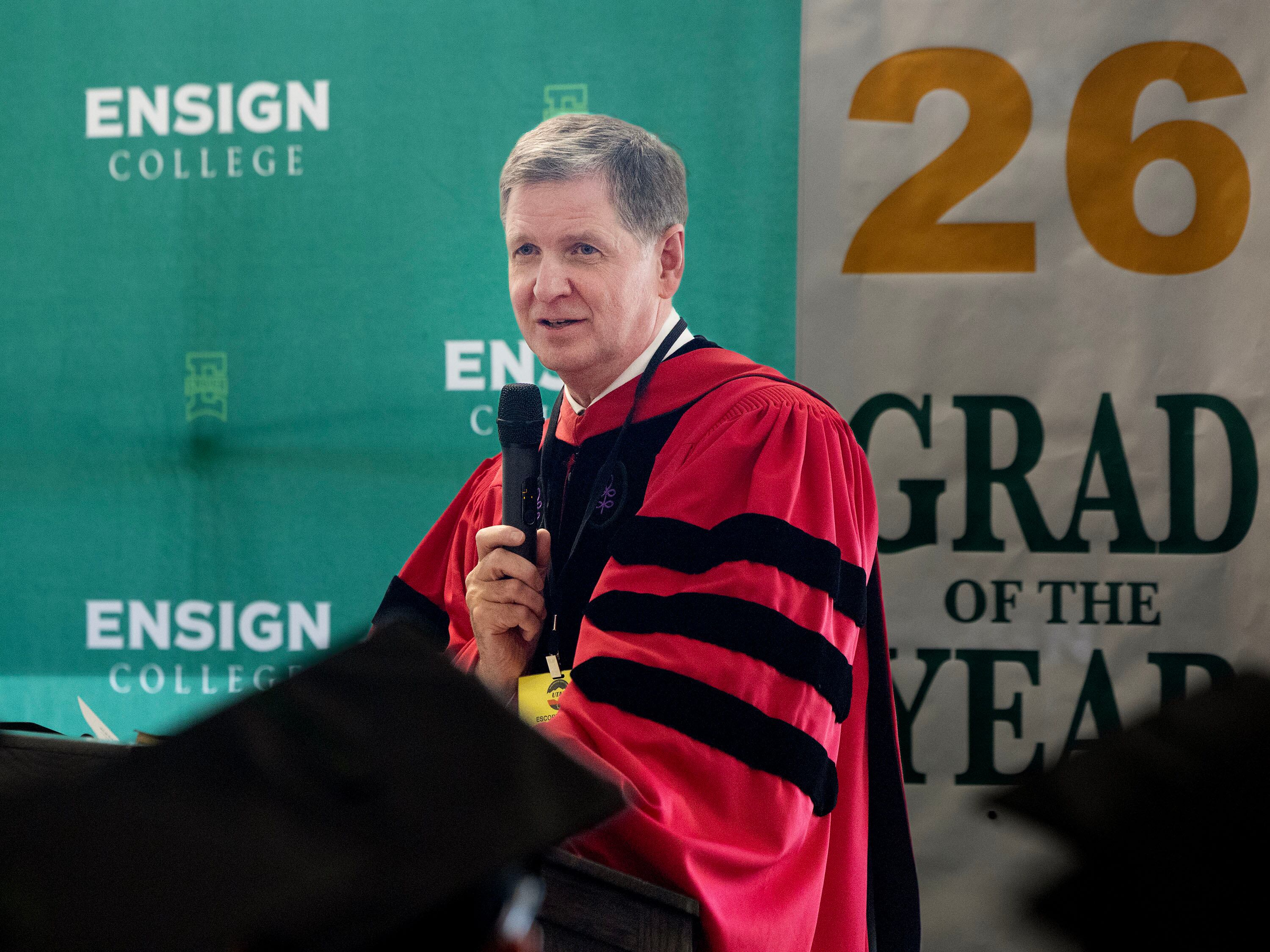 Elder James R. Rasband, a General Authority Seventy and commissioner for the Church Educational System, speaks to graduates of the Ensign College Prison Education Program at the Utah State Correctional Facility in Salt Lake City on Wednesday. Elder Rasband spoke to graduates about finding light in dark places.