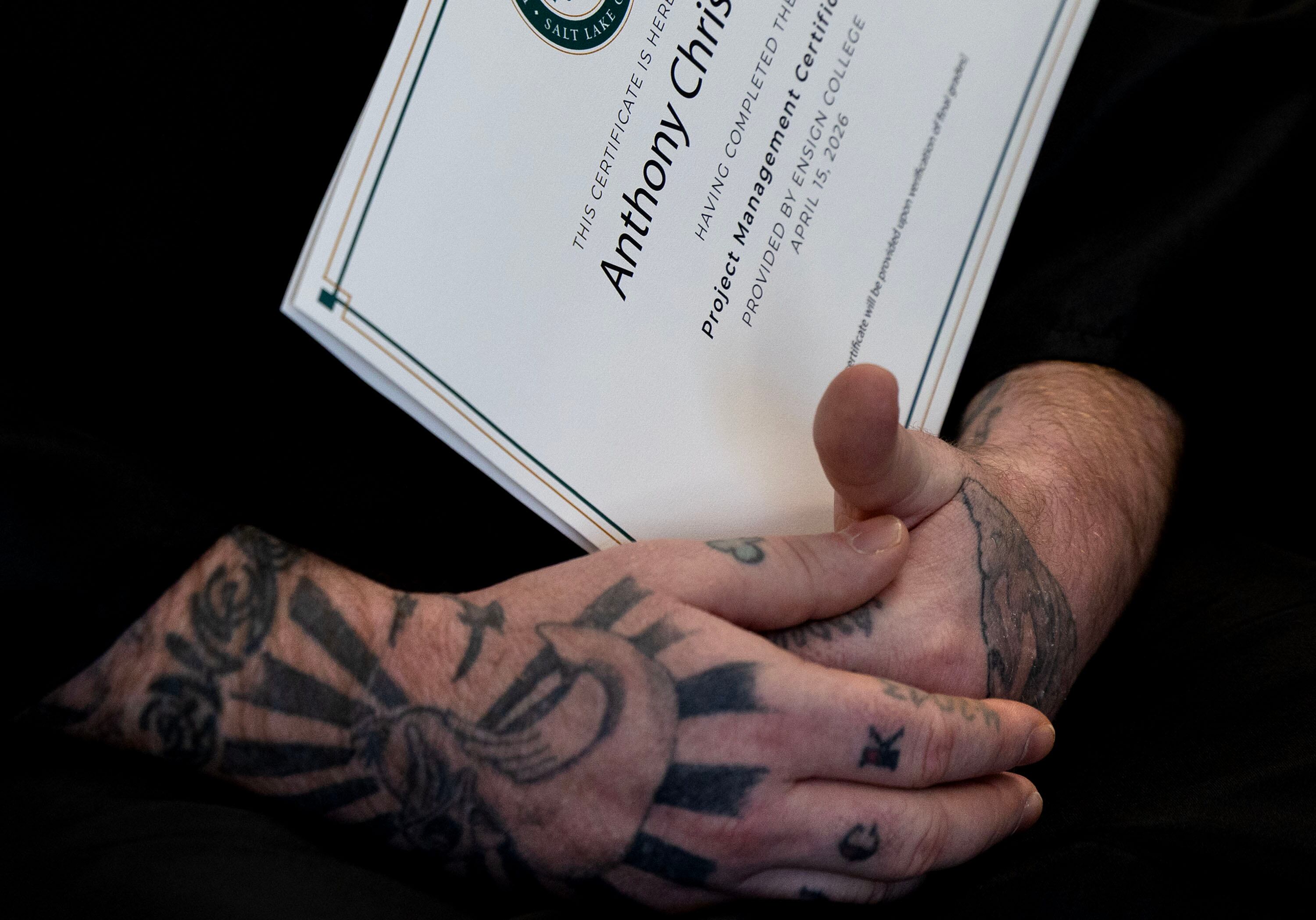 Anthony holds his graduation certificate at the ceremony for Ensign College Prison Education Program graduates at the Utah State Correctional Facility in Salt Lake City on Wednesday. The ceremony was the first held off-campus in the school's history.