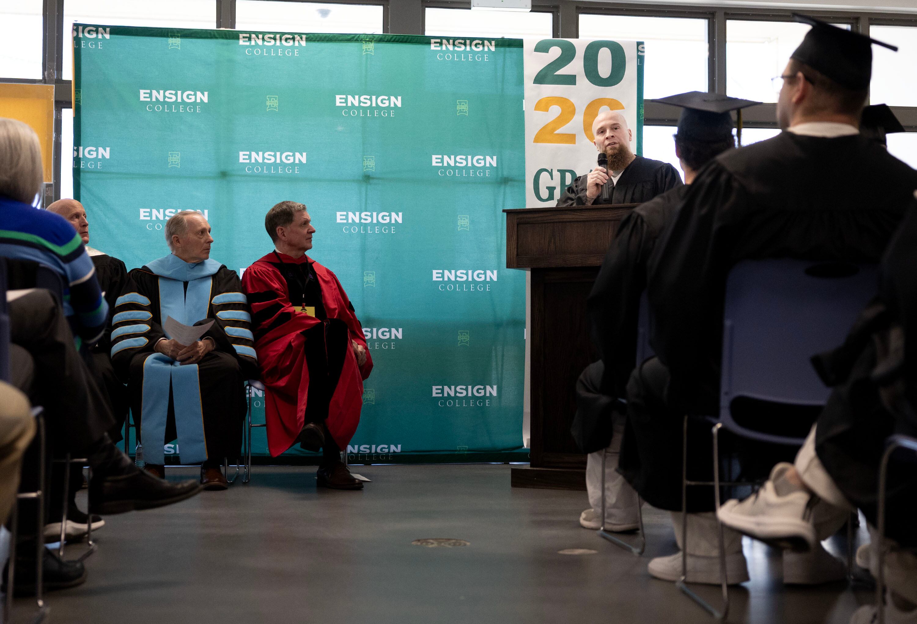 Dennis W. speaks at the Ensign College Prison Education Program graduation at the Utah State Correctional Facility in Salt Lake City on Wednesday. Dennis spoke about how Christ found him in his lowest moments.