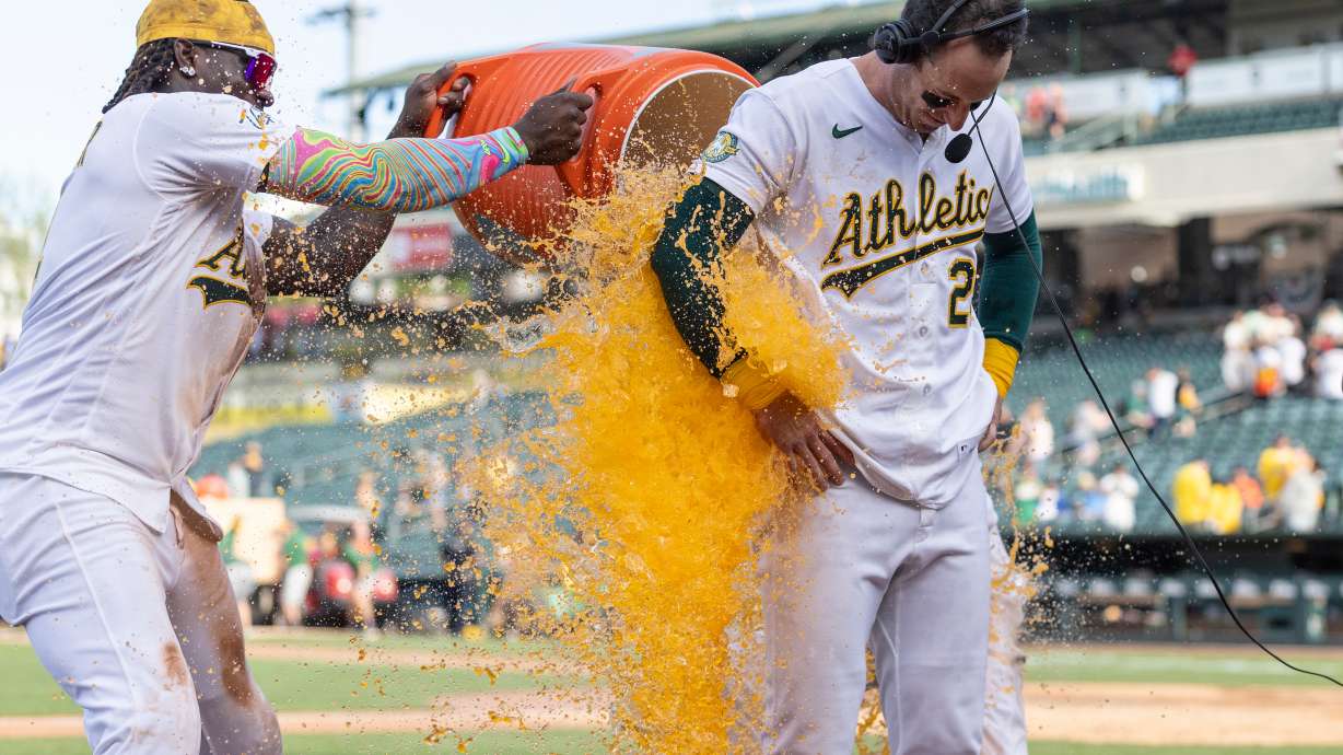 Athletics' Lawrence Butler, left, and Max Muncy dump Gatorade on Brent Rooker, right, after he hit a walk-off three-run home run during the tenth inning of a baseball game against the Houston Astros April 5, in West Sacramento, Calif. Gatorade is getting a rebrand, no longer focusing primarily on athletes.