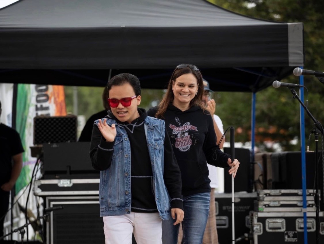 Kodi Lee and his mom Tina Lee leave the stage after a performance. Lee, the winner of "America's Got Talent" in 2019, just released his debut album.