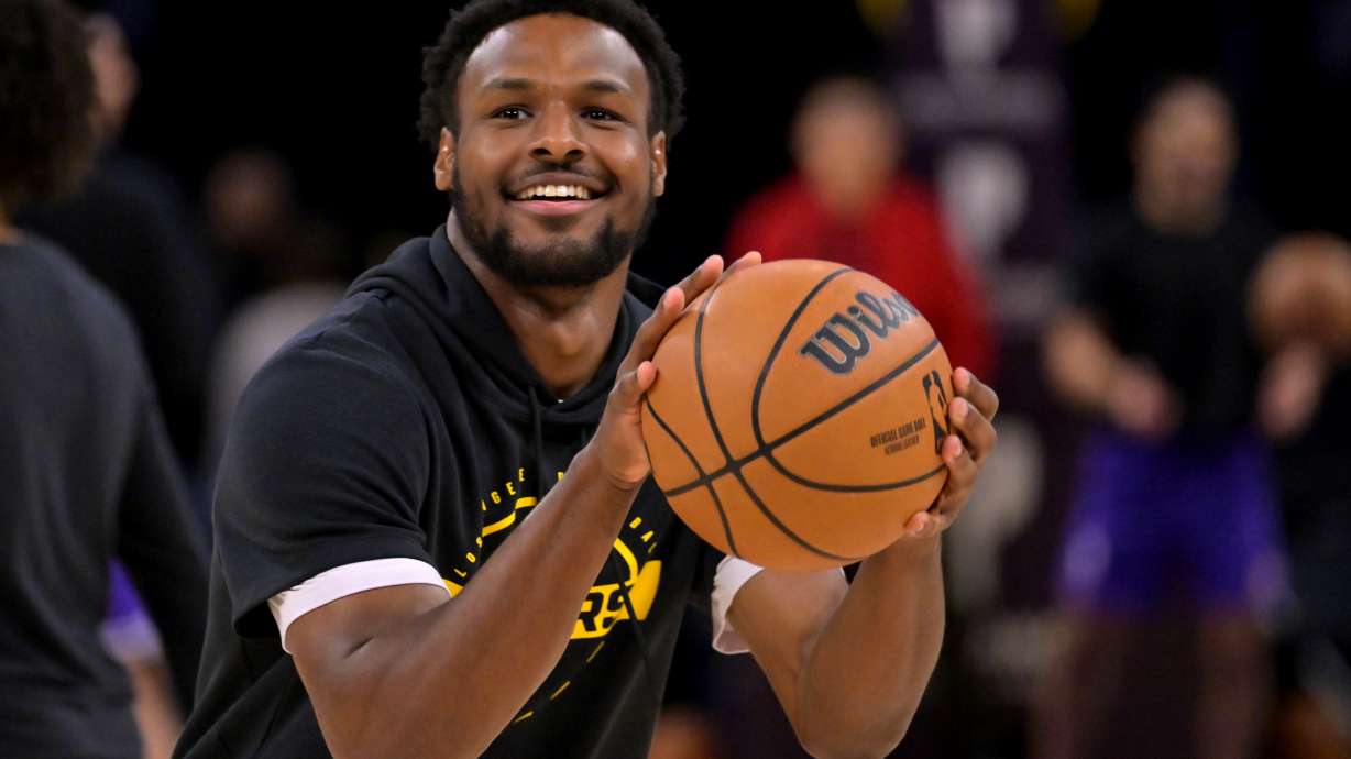 Los Angeles Lakers guard Bronny James warms up prior to an NBA basketball game against the Utah Jazz, Sunday, April 12, 2026, in Los Angeles.