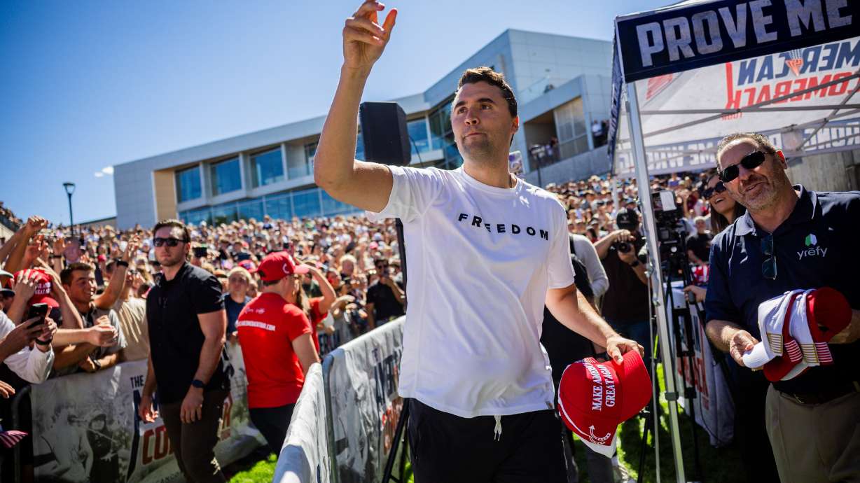 Charlie Kirk, the CEO and co-founder of the conservative youth organization Turning Point USA, hands out hats before he was fatally shot during Turning Point USA’s visit to Utah Valley University in Orem on Sept. 10, 2025.