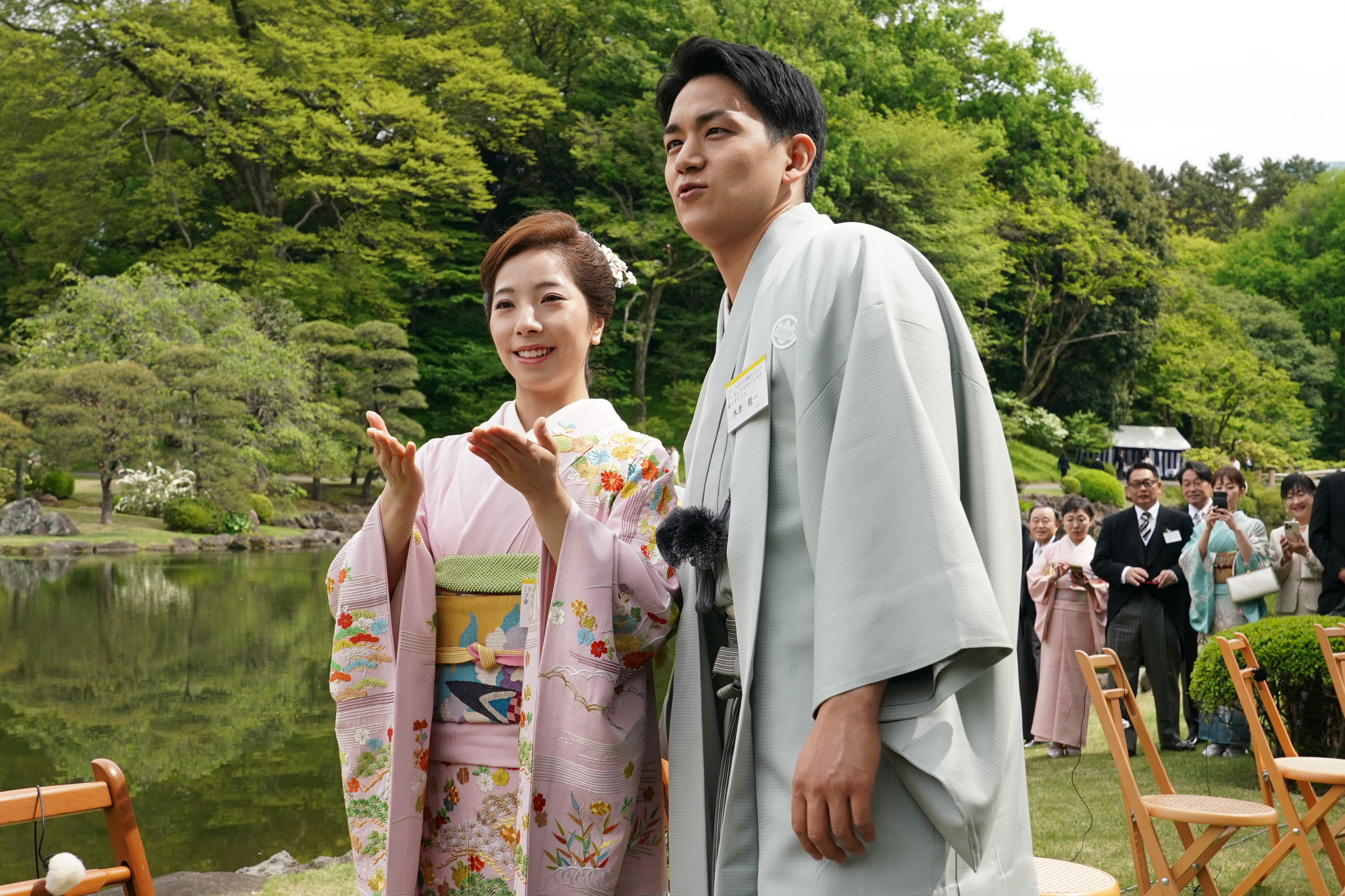 Japanese Olympic figure skating pairs champions Riku Miura, left, and Ryuichi Kihara attend a spring garden party hosted by Japan's Emperor Naruhito and Empress Masako at the Akasaka Palace's imperial garden in Tokyo, Friday, April 17, 2026. 