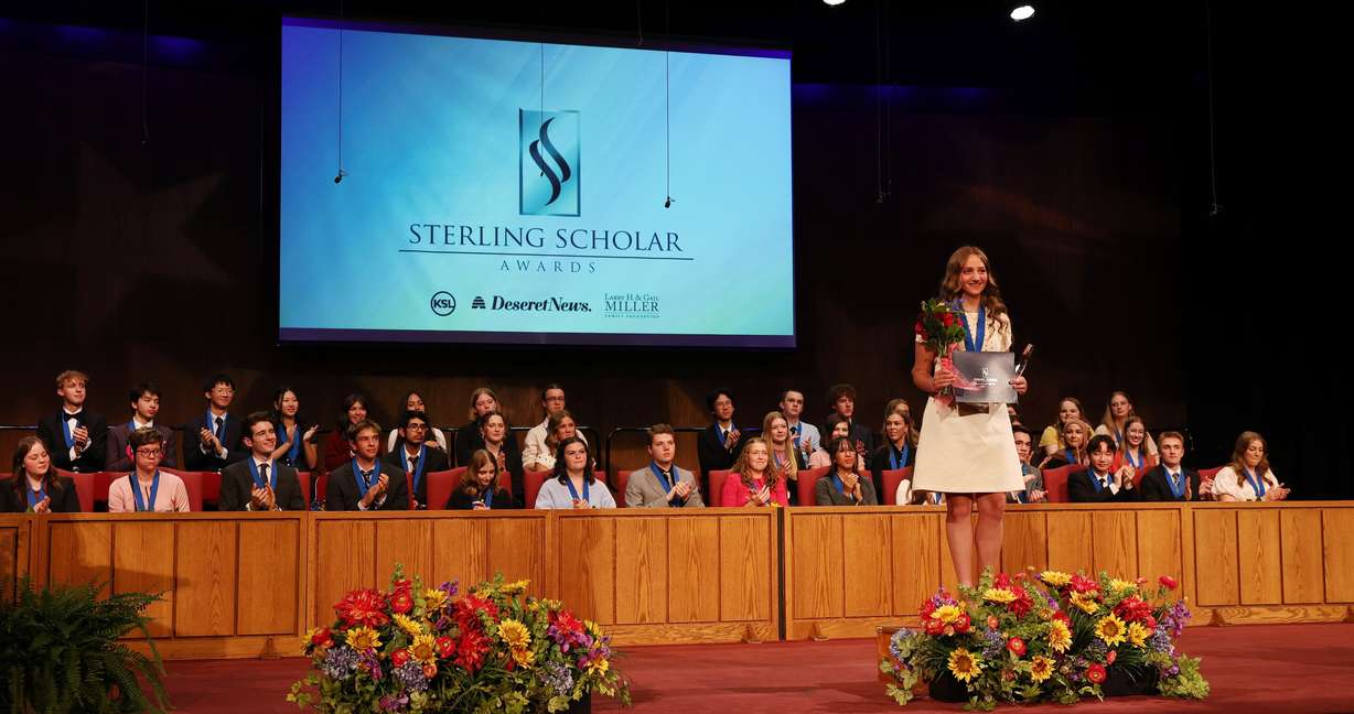 Marjorie Morley of American Leadership Academy is honored with the Gail Miller Community Service Award during the Sterling Scholar Awards presentation at the Bountiful Regional Center in Bountiful, Thursday.