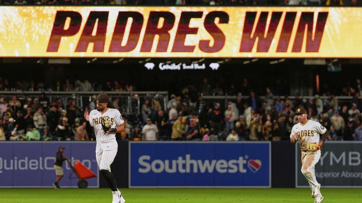 San Diego Padres right fielder Fernando Tatis Jr., left, and left fielder Ramón Laureano celebrate after the Padres defeated the Seattle Mariners 5-2 in a baseball game Thursday, April 16, 2026, in San Diego.