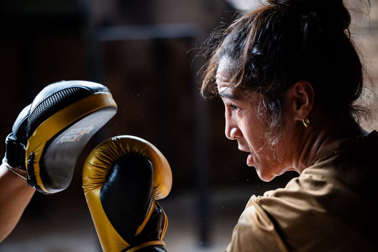 World boxing champion Lani Daniels, a member of The Church of Jesus Christ of Latter-day Saints, trains at her friend Caroline Kreutzkamp’s home in Orem on April 10. Daniels’ next fight is at Madison Square Garden in New York City on Friday.
