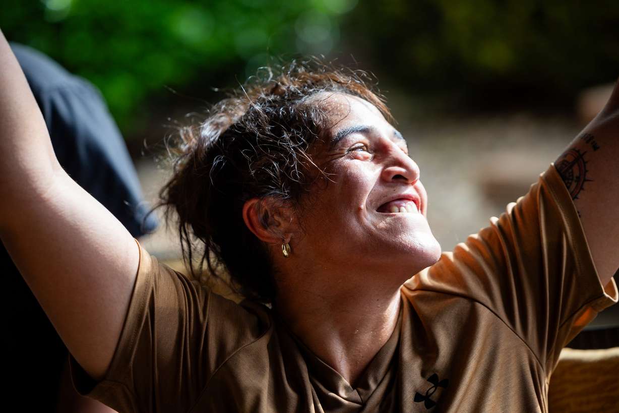 World boxing champion Lani Daniels, a member of The Church of Jesus Christ of Latter-day Saints, smiles after a training session at her friend Caroline Kreutzkamp’s home in Orem on April 10. Daniels’ nickname is "The Smiling Assassin."
