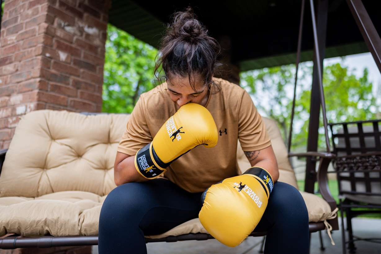 World boxing champion Lani Daniels, a member of The Church of Jesus Christ of Latter-day Saints, takes a rest while training at her friend Caroline Kreutzkamp’s home in Orem on April 10. Daniels said she is "blessed" to be doing what she is doing.