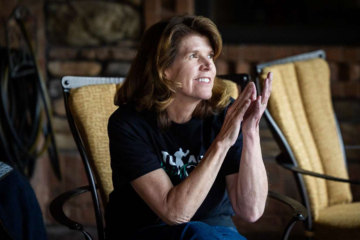 Caroline Kreutzkamp watches world boxing champion Lani Daniels, a member of The Church of Jesus Christ of Latter-day Saints, train at her home in Orem on April 10. Kreutzkamp's home has since turned into Daniels' home base for training.