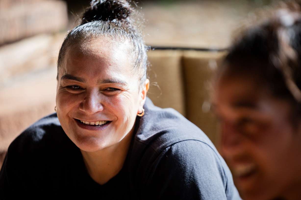 Caroline Daniels smiles at her sister, world boxing champion, Lani Daniels, a member of The Church of Jesus Christ of Latter-day Saints, after training with her at their friend Caroline Kreutzkamp’s home in Orem on April 10. Lani Daniels said she is grateful to have the Kreutzkamps supporting her and her family.