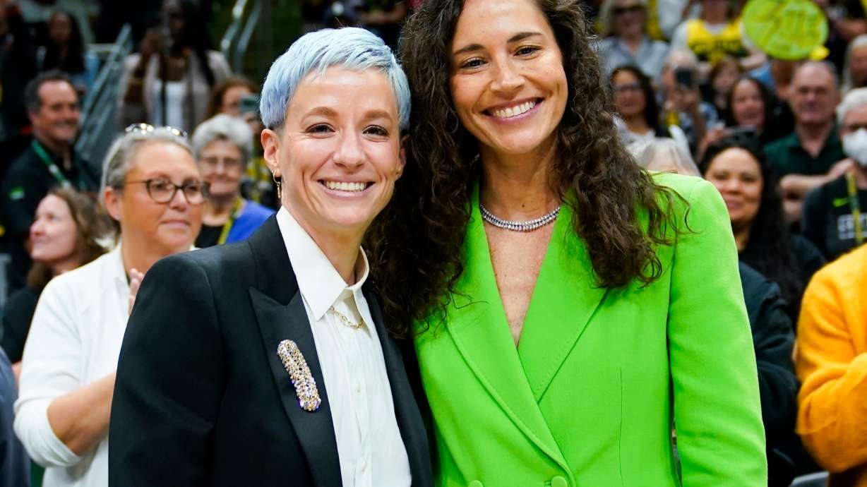 FILE - Megan Rapinoe, left, and Sue Bird pose for photographs before a WNBA basketball game between the Storm and the Washington Mystics, Sunday, June 11, 2023, in Seattle.