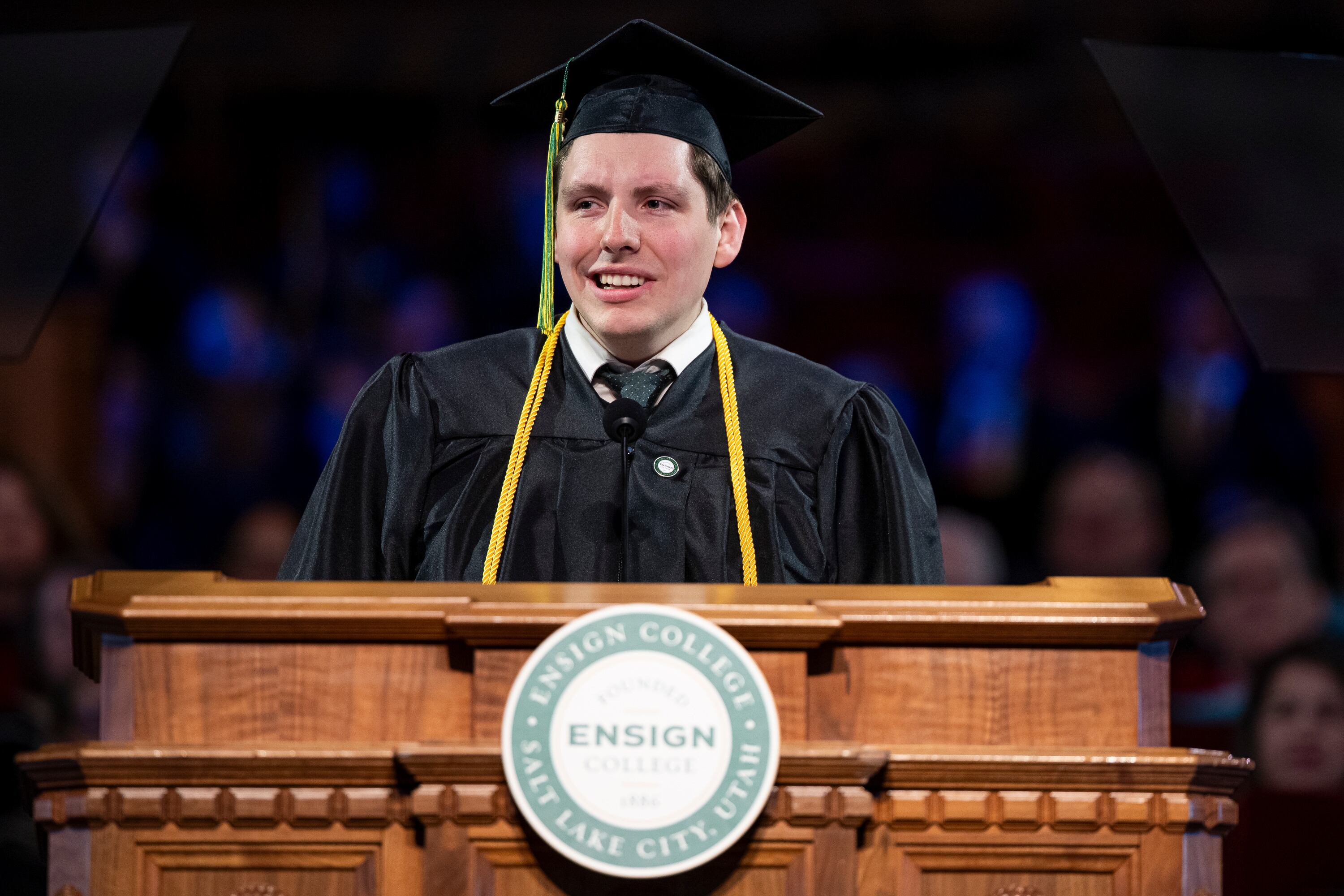 Cameron Kohutek, a Bachelor of Applied Science graduate in accounting, from Farmington, Utah, speaks during the 139th Ensign College commencement exercises at the Salt Lake Tabernacle on Temple Square in Salt Lake City on Friday. Kohutek said to graduates that they are living witnesses of the unifying power of the gospel of Jesus Christ.