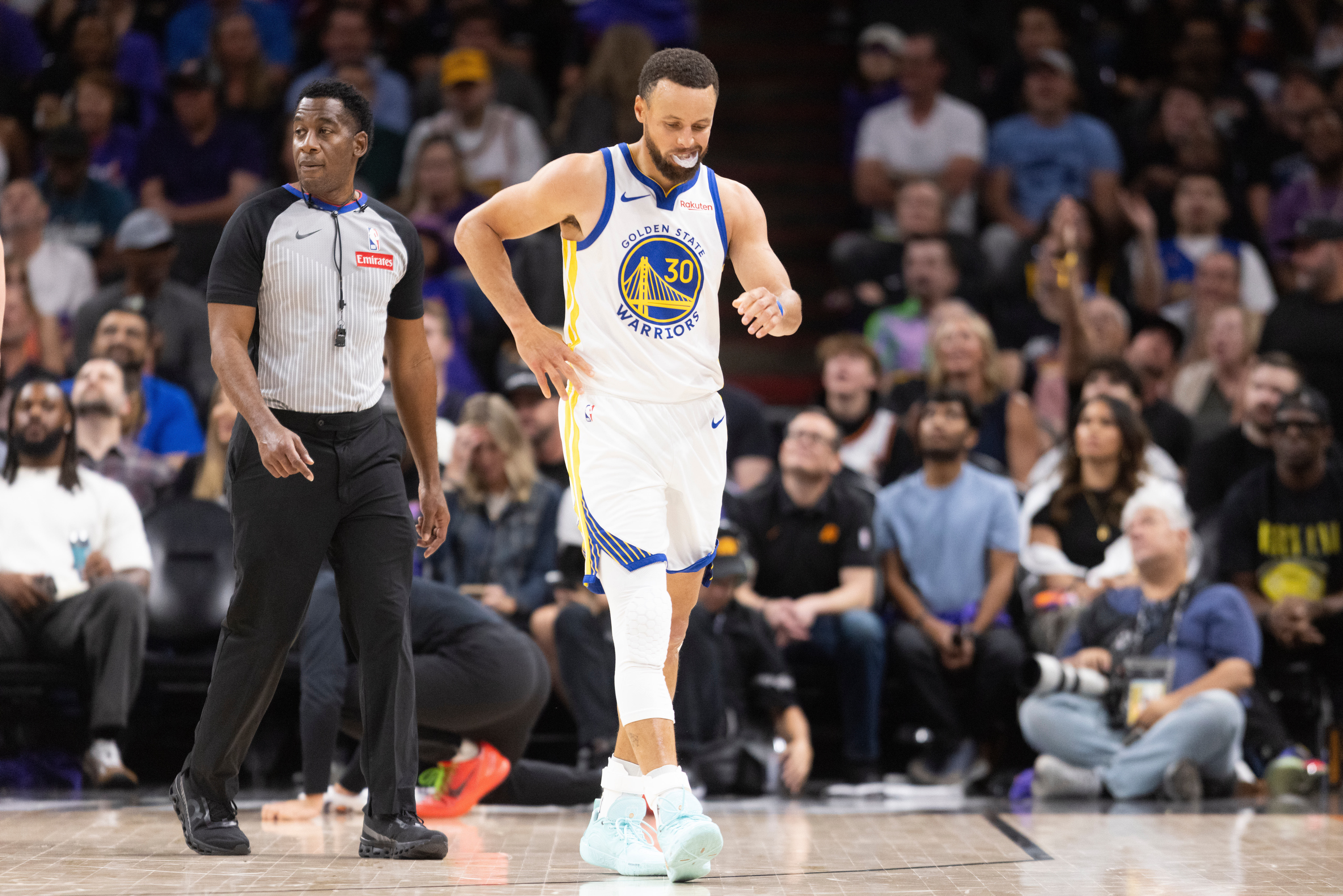 Golden State Warriors guard Stephen Curry (30) walks during the first half of his NBA play-in tournament game against the Phoenix Suns in Phoenix, Ariz., Friday, April 17, 2026. 