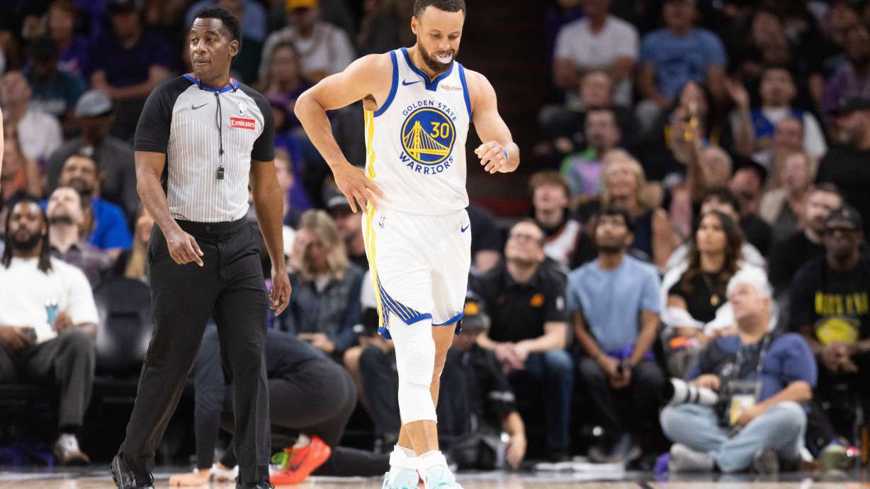 Golden State Warriors guard Stephen Curry (30) walks during the first half of his NBA play-in tournament game against the Phoenix Suns in Phoenix, Ariz., Friday, April 17, 2026.