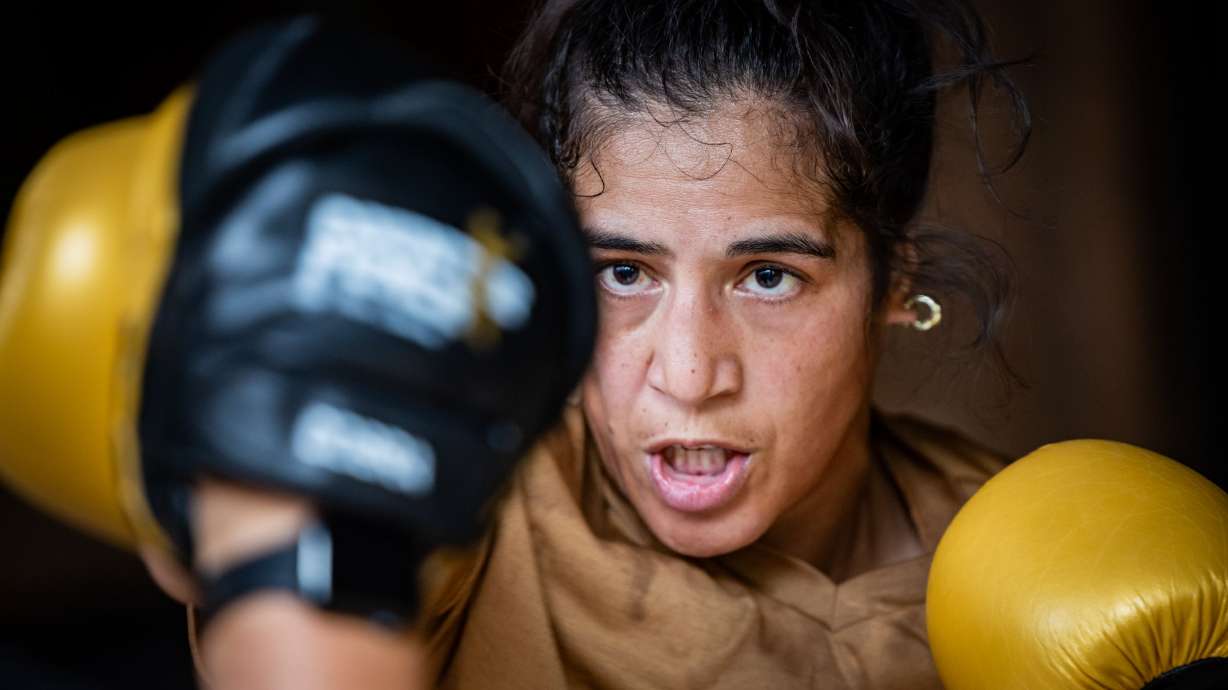 Boxing champion Lani Daniels, a member of The Church of Jesus Christ of Latter-day Saints, trains at Caroline Kreutzkamp’s home in Orem on April 10. Daniels claimed the WBO/IBF super middleweight title at Madison Square Garden Friday.