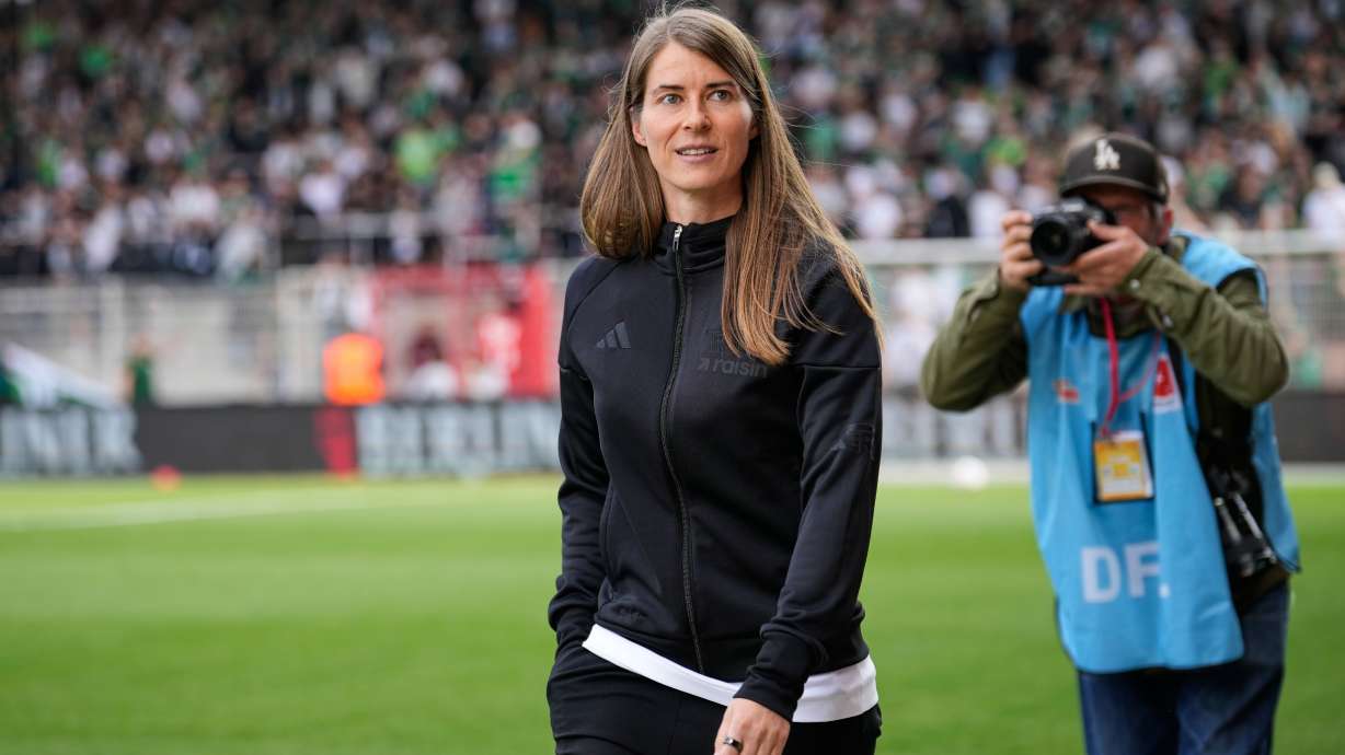 New head coach of German Bundesliga soccer club 1. FC Union Berlin Marie-Louise Eta looks on during the warm up prior to the German Bundesliga soccer match between FC Union Berlin and Wolfsburg in Berlin, Germany, Saturday, April 18, 2026.