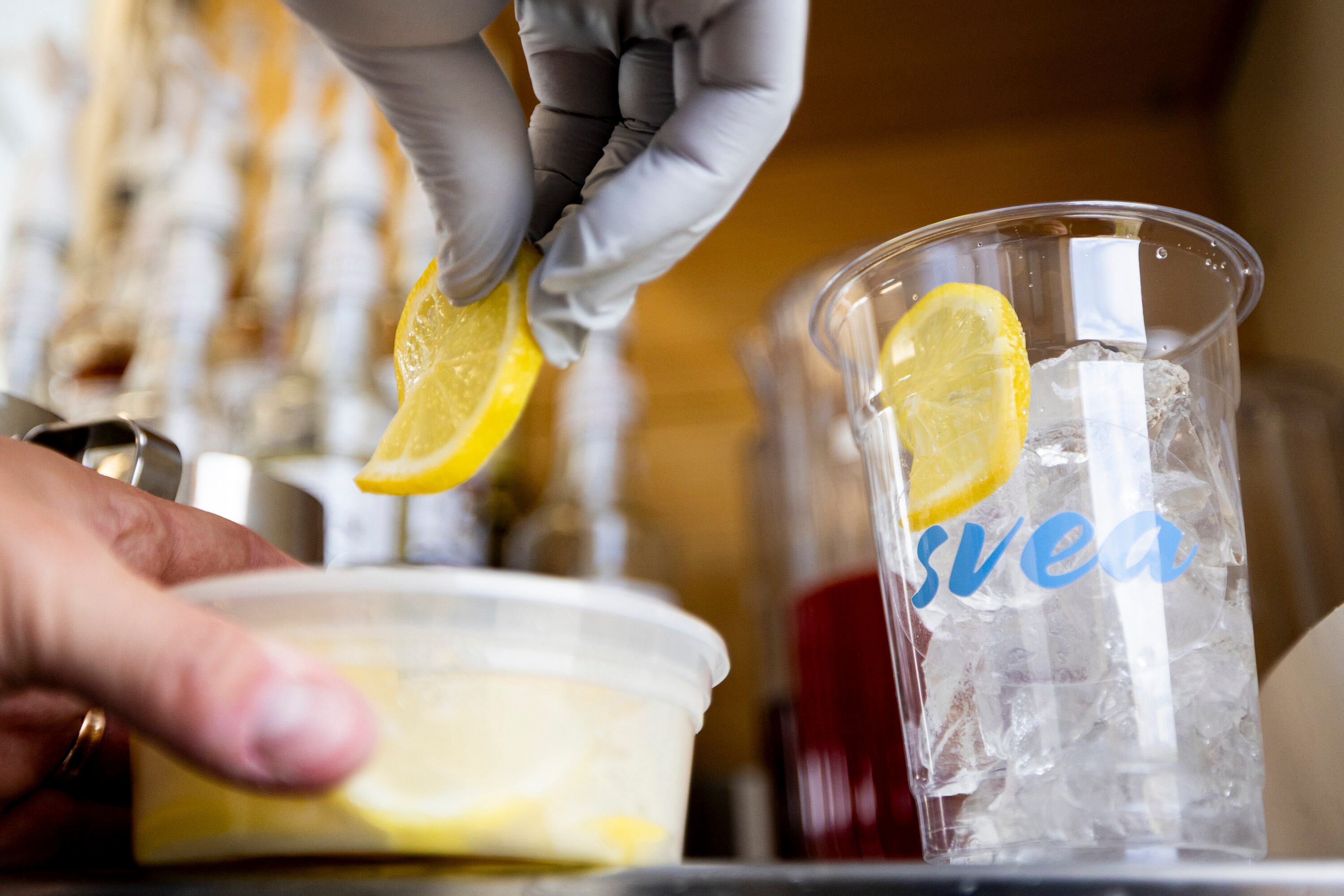 Alfred Kilis, co-owner of SVEA Scandinavian Kafé on Wheels, prepares a lemon elderflower iced refresher in his food truck in Eagle Mountain on April 10.