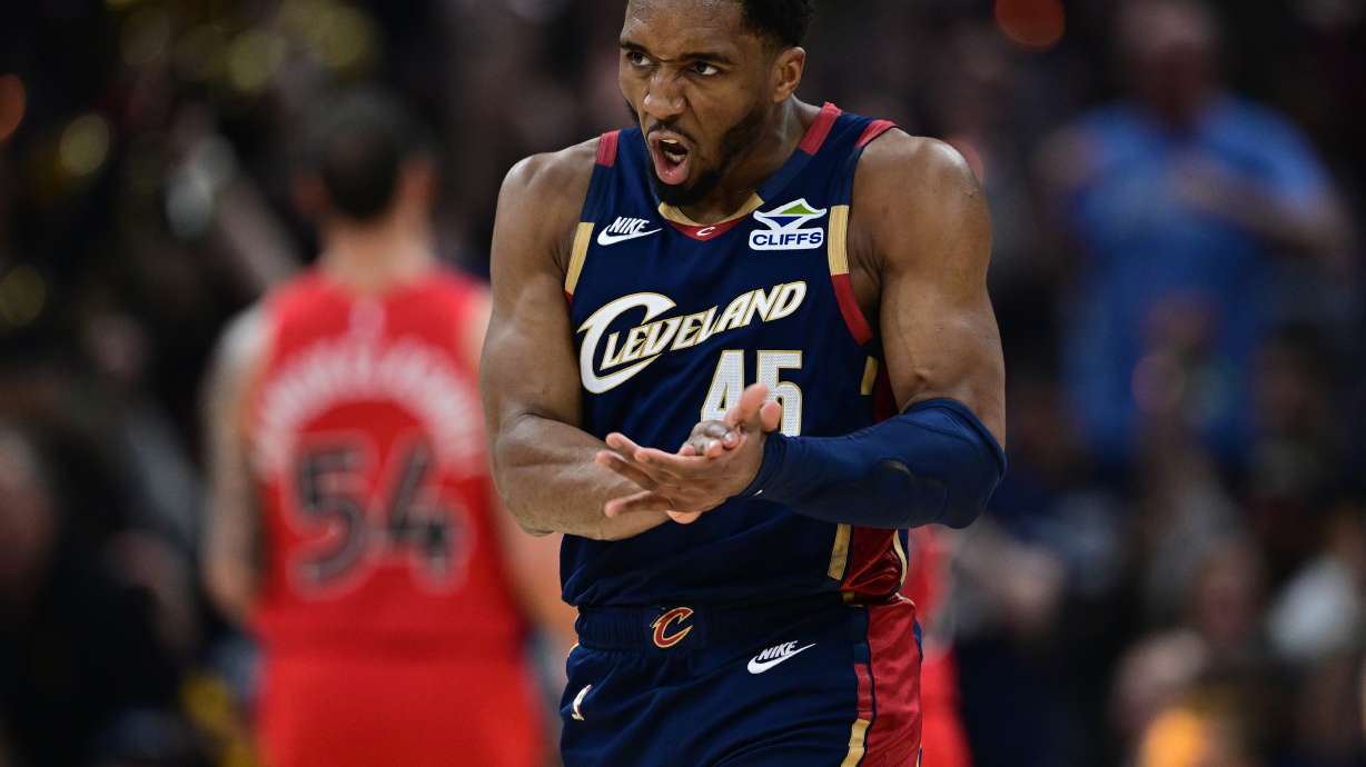 Cleveland Cavaliers guard Donovan Mitchell reacts after an assist during the first half in Game 1 of a first-round NBA playoffs basketball series against the Toronto Raptors, Saturday, April 18, 2026, In Cleveland.