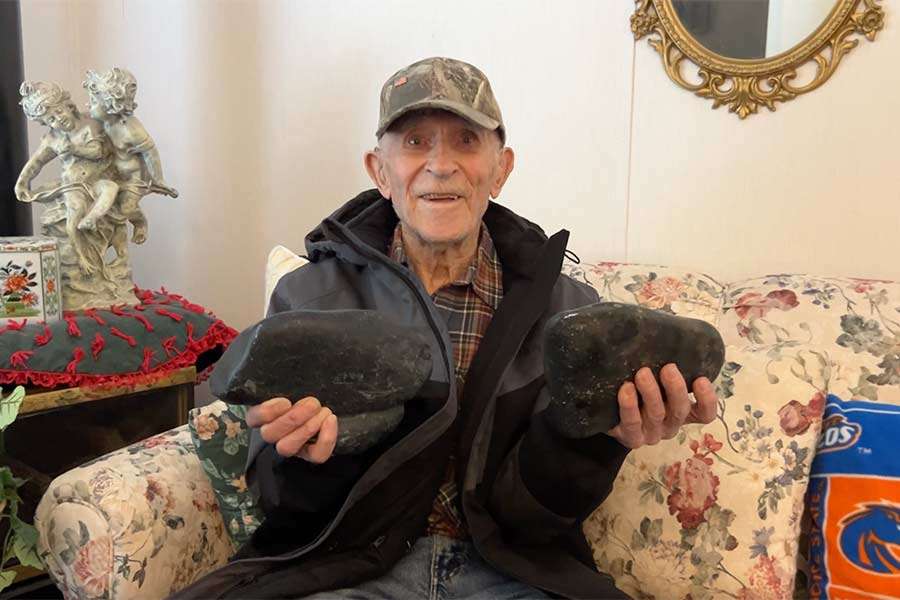 Virgil Jonak holds stones from the Teton Dam construction at his home in Shelley, Idaho, Saturday. Jonak was a former truck driver during the dam's construction.