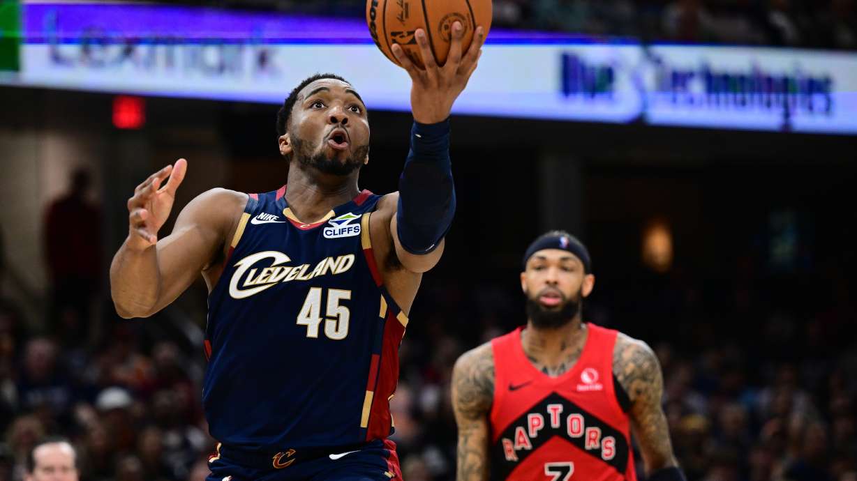 Cleveland Cavaliers guard Donovan Mitchell goes to the basket against the Toronto Raptors during the second half in Game 1 of a first-round NBA playoffs basketball series, Saturday, April 18, 2026, In Cleveland.