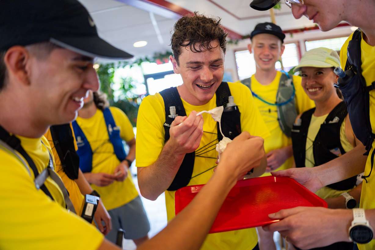 Joseph Carwin, center, eats ice cream at Olympus Burger while attempting to set a Guinness World Record for fast-food eating in a 24-hour period with seven of his friends in Sandy on April 11.