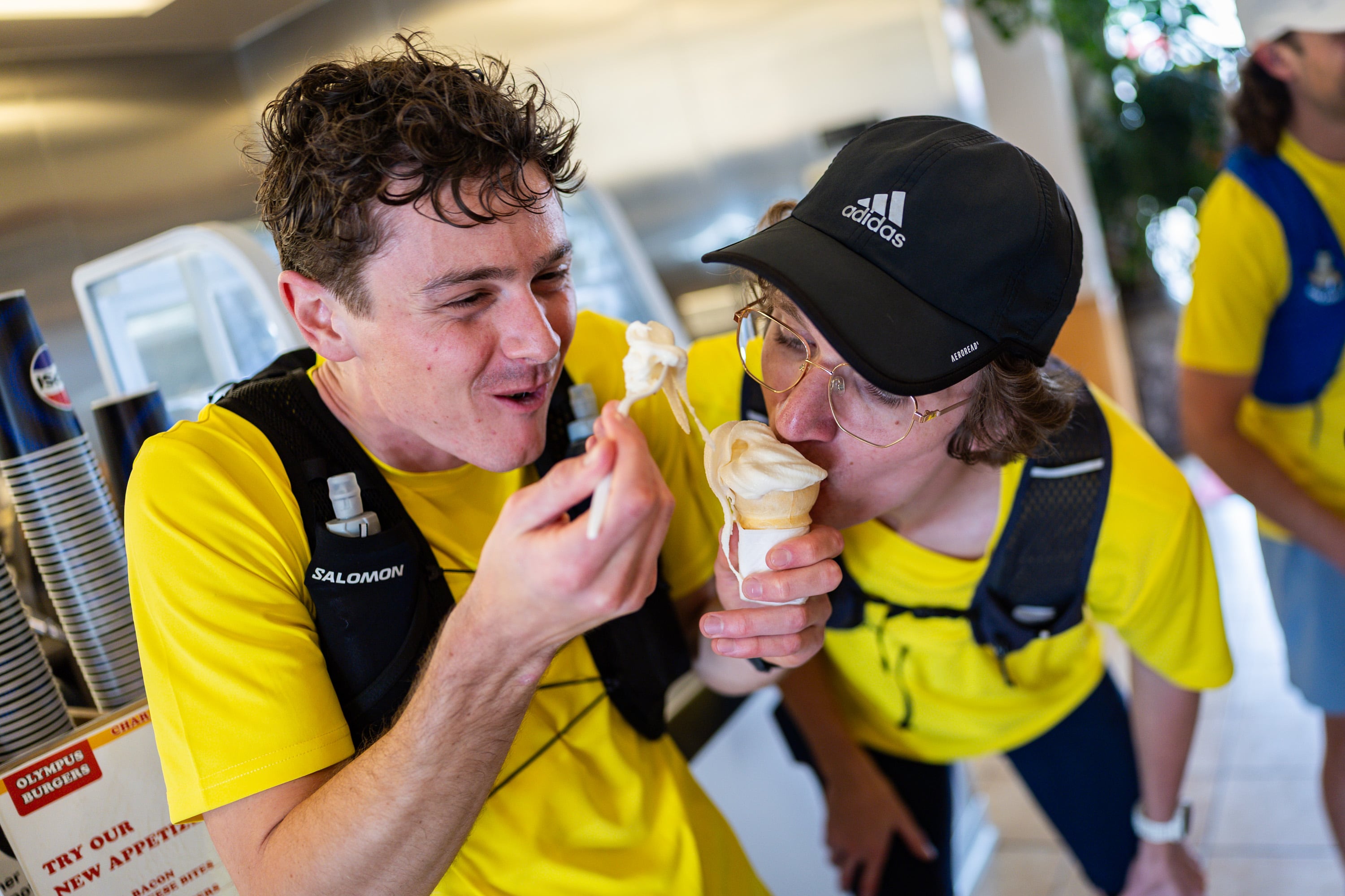 Joseph Carwin, left, and Henry Giles, right, eat ice cream at Olympus Burger while attempting to set a Guinness World Record for fast-food eating in a 24-hour period with six of their friends in Sandy on April 11.