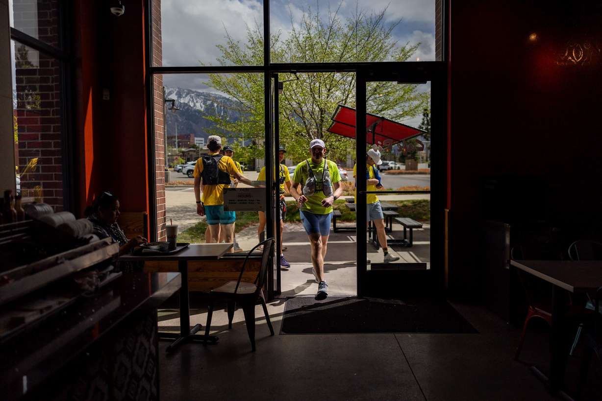 Jayson Call walks into Cafe Rio while attempting to set a Guinness World Record for fast-food eating in a 24-hour period with seven of his friends in Sandy on April 11.