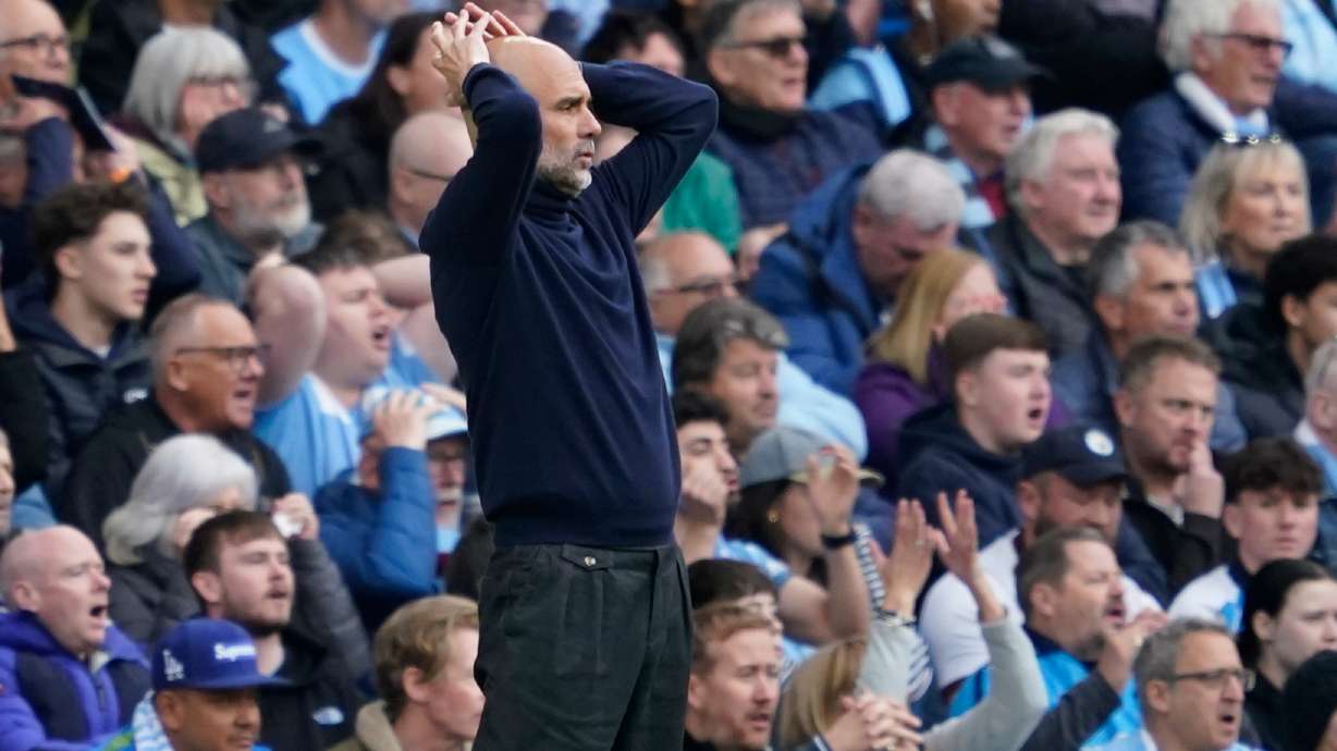 Manchester City's head coach Pep Guardiola gestures during the English Premier League soccer match between Manchester City and and Arsenal, in Manchester, England, Sunday, April 19, 2026.