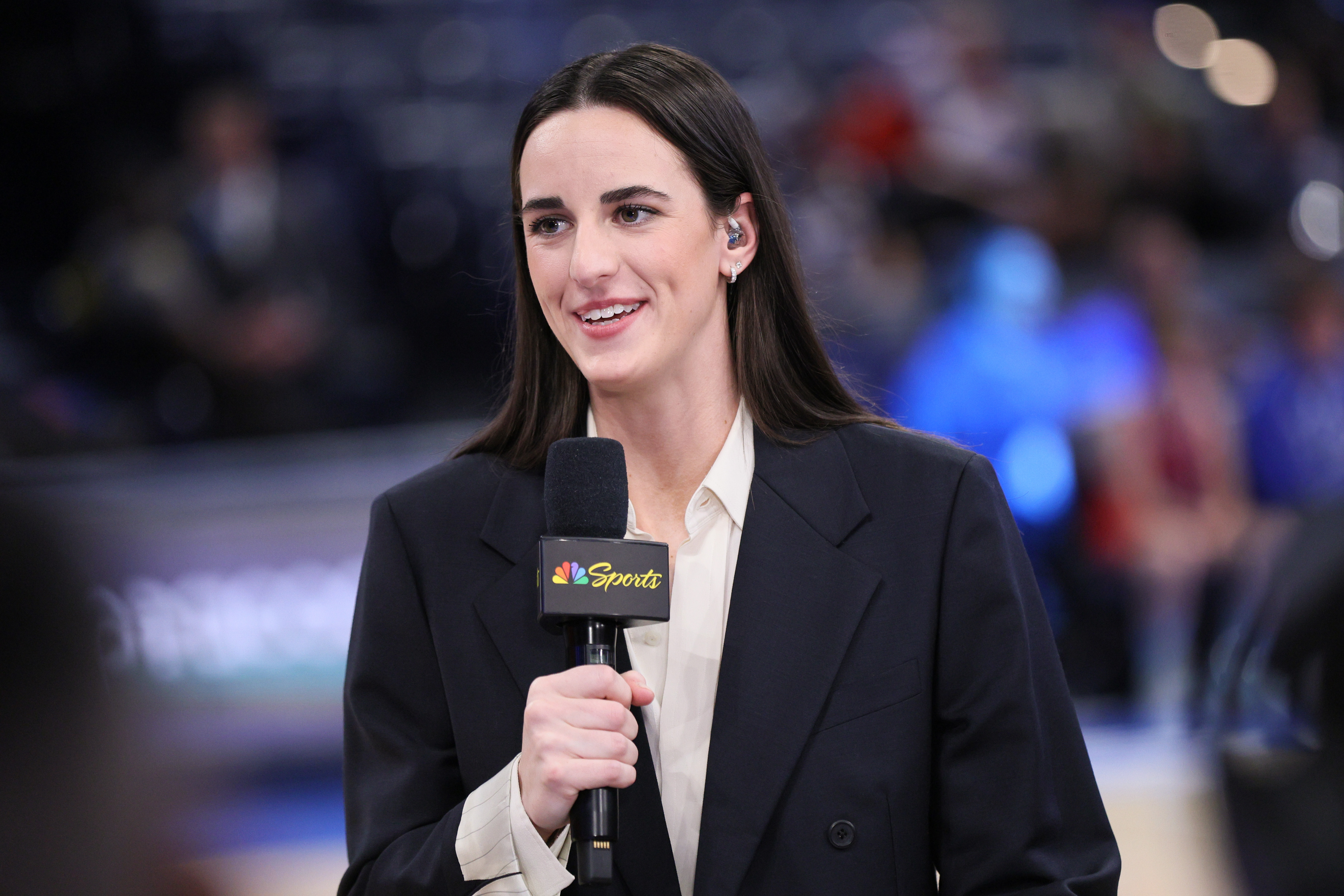Indiana Fever guard Caitlin Clark participates in an NBC Sports broadcast before an NBA basketball game between the New York Knicks and the Oklahoma City Thunder, Sunday, March 29, 2026, in Oklahoma City. 