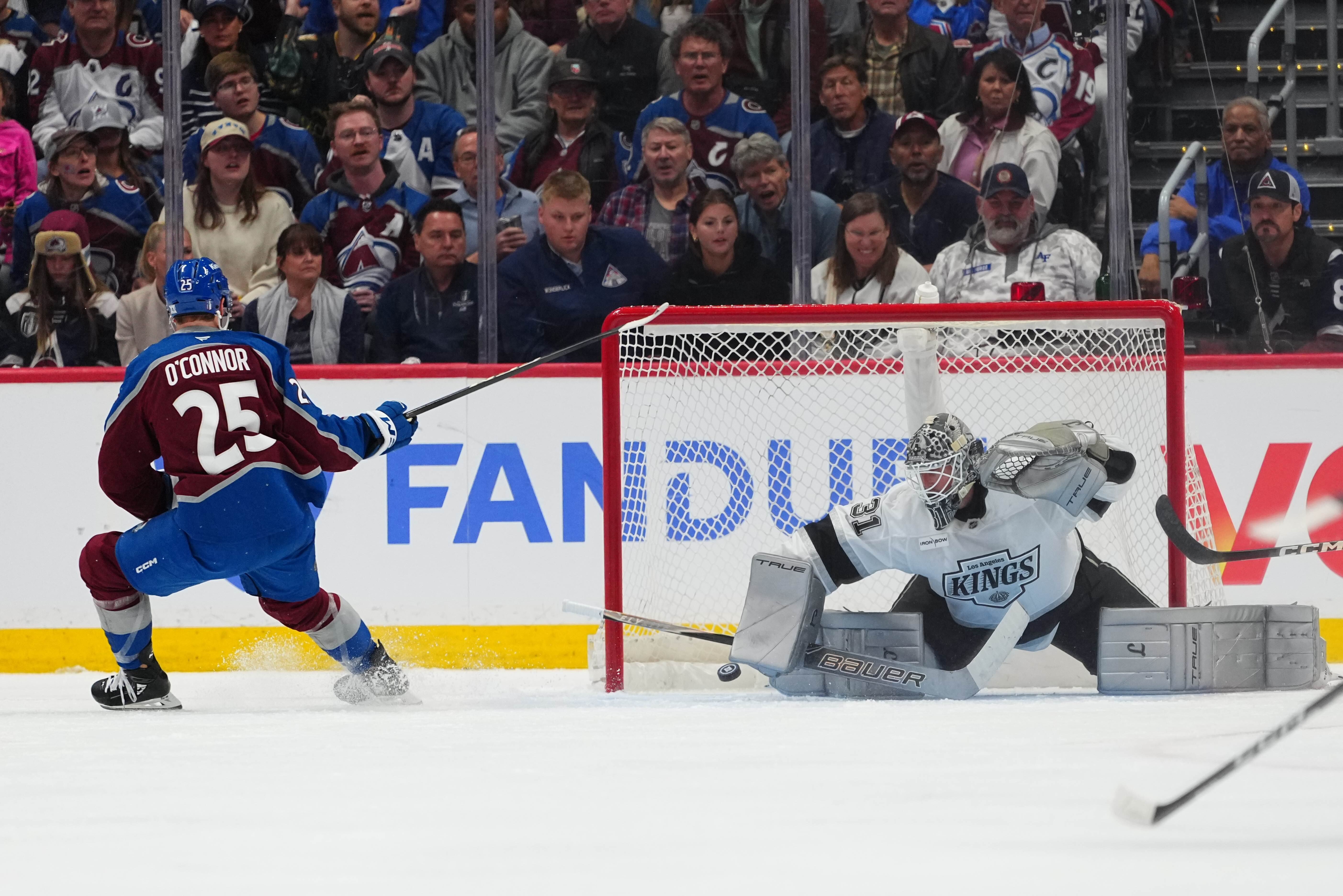 Colorado Avalanche right wing Logan O'Connor (25) scores against Los Angeles Kings goaltender Anton Forsberg (31) during the third period of Game 1 in the first round of the NHL hockey Stanley Cup playoffs, Sunday, April 19, 2026, in Denver. 