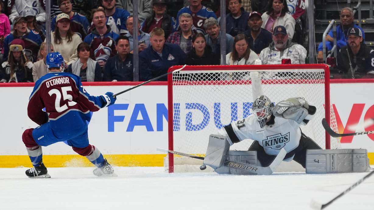 Colorado Avalanche right wing Logan O'Connor (25) scores against Los Angeles Kings goaltender Anton Forsberg (31) during the third period of Game 1 in the first round of the NHL hockey Stanley Cup playoffs, Sunday, April 19, 2026, in Denver.